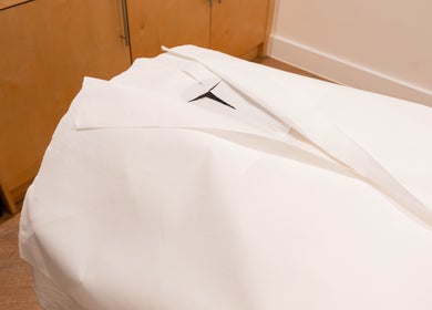 A pristine treatment bed at Francisca Wellbeing Studio, London, England, GB, ready for a relaxing session.