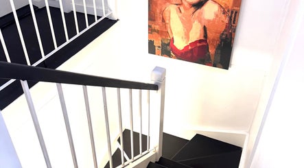 Staircase with vibrant art at Leaha Body & Skin Fix Toowoomba, East Toowoomba, Queensland, AU.