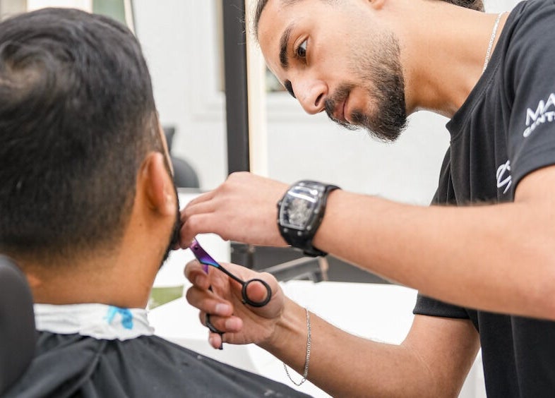 Expert barber providing haircut at Mantis Gent’s Salon - Yas Island, Abu Dhabi, AE.
