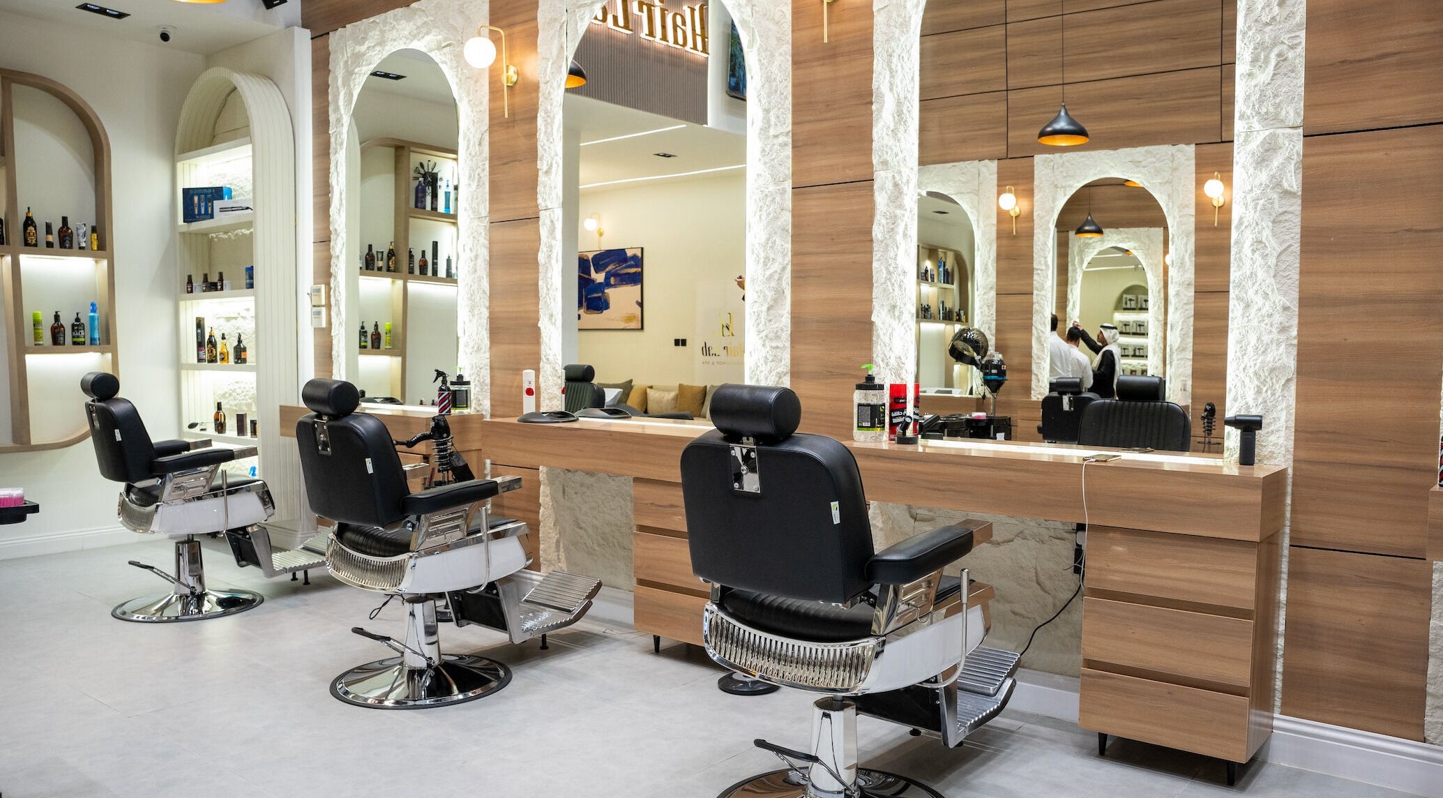 Modern salon interior at Hair Lab, Riyadh, Riyadh Province, SA with stylish chairs and mirrors.