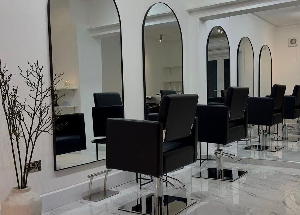 Modern styling chairs and mirrors at STUDIO HONEY, Southampton, England, GB offer sleek elegance.