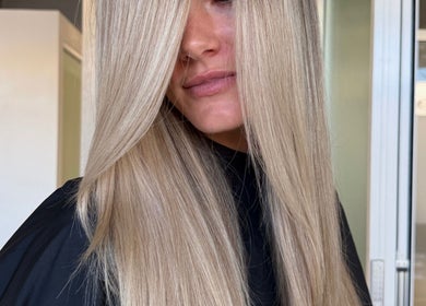 Blonde hair styled at STUDIO QUE, Innaloo, Western Australia, AU. Modern salon with sleek decor.