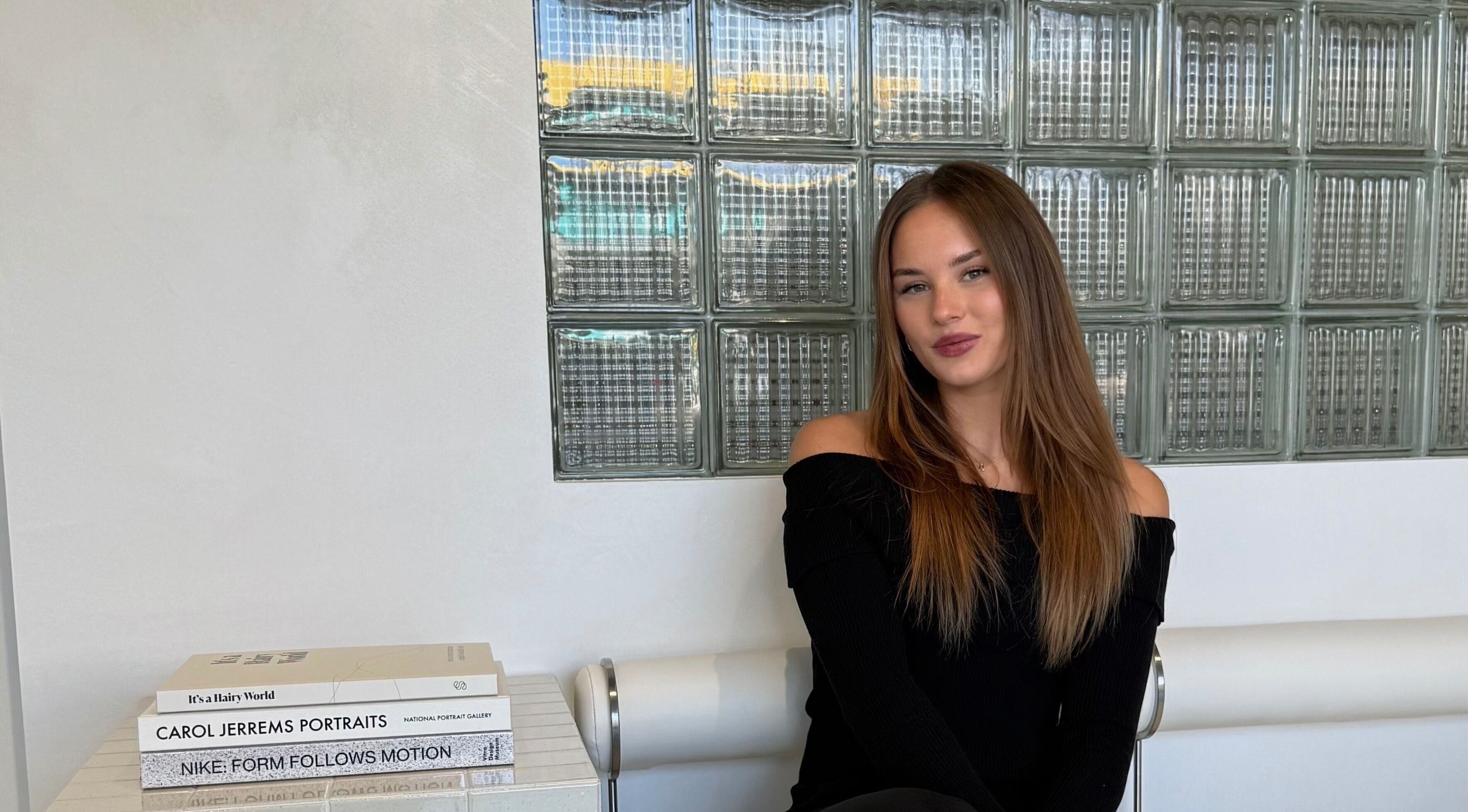 Sophisticated woman seated at STUDIO QUE, Innaloo, Western Australia, AU, showcasing modern style.