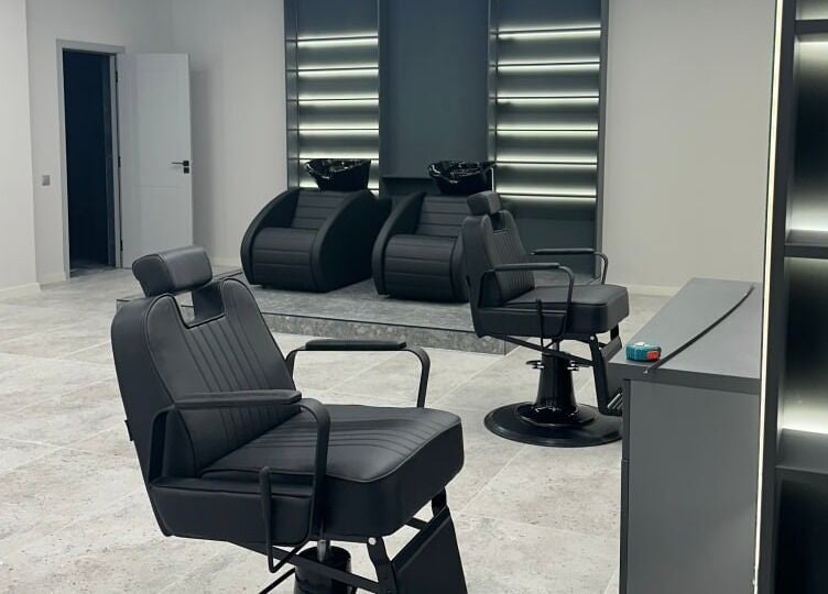 Modern barber chairs at Barber&Co, Chișinău, Chișinău, MD, offering a sleek and stylish grooming experience.