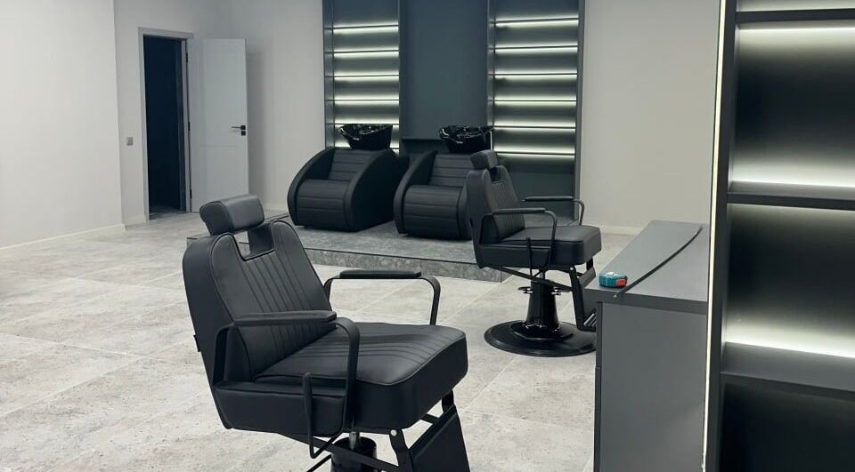 Modern barber chairs at Barber&Co, Chișinău, Chișinău, MD, offering a sleek and stylish grooming experience.