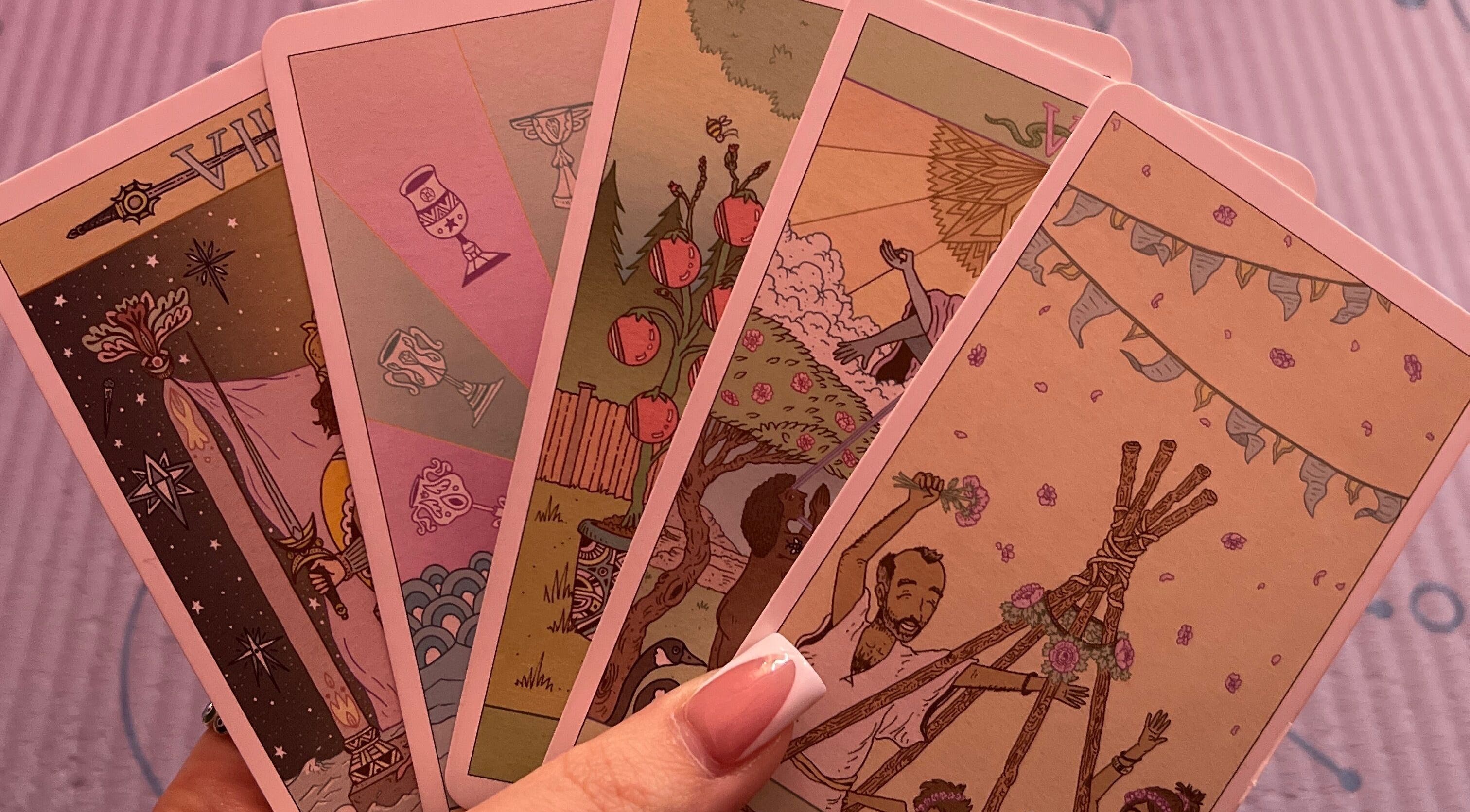 Tarot card reading at Her Magickal Touch in Bridgewater, Virginia, US featuring vibrant, mystical designs.