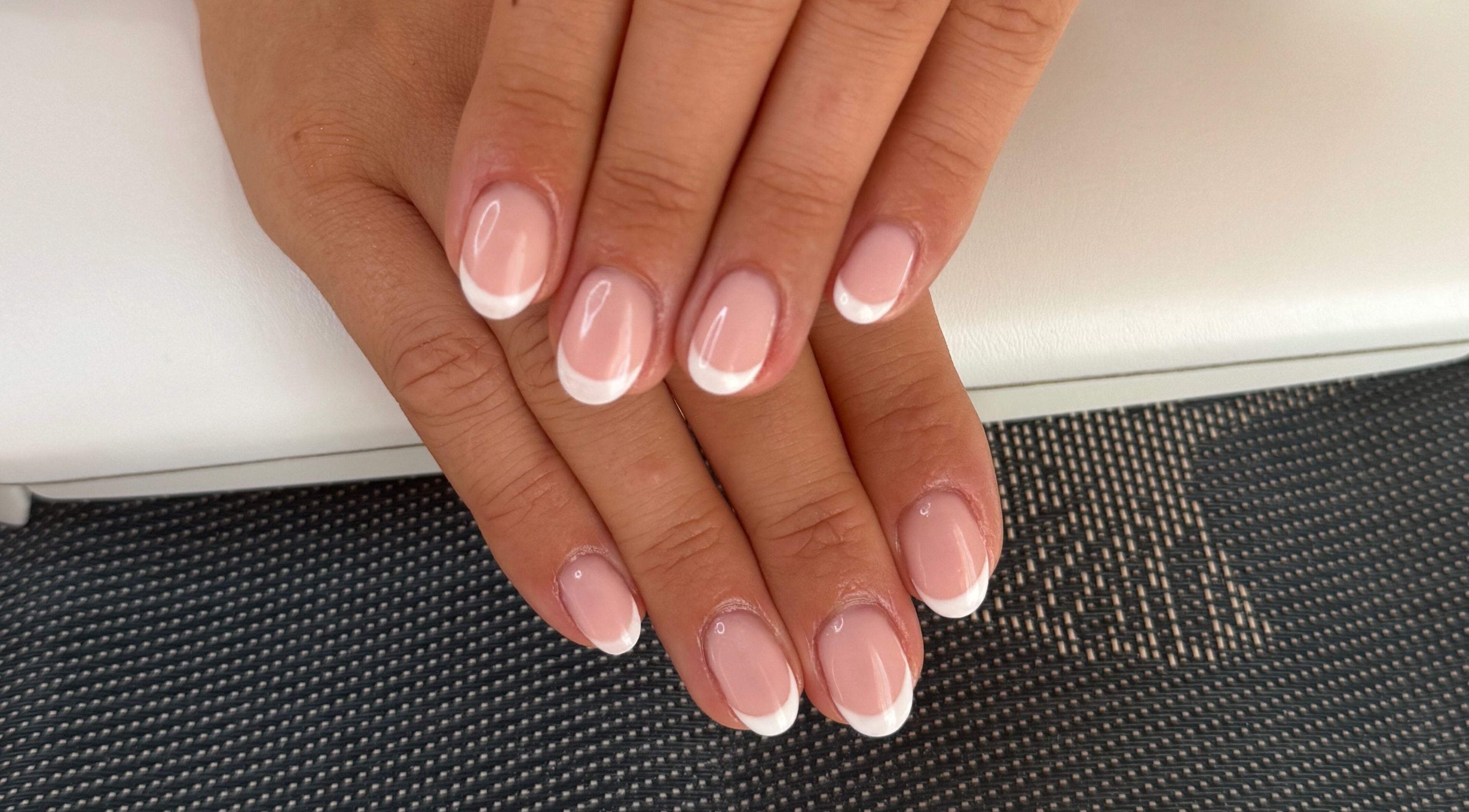Perfect French manicure at BlushBeauty, Poole, England, GB showcasing elegant nail art.