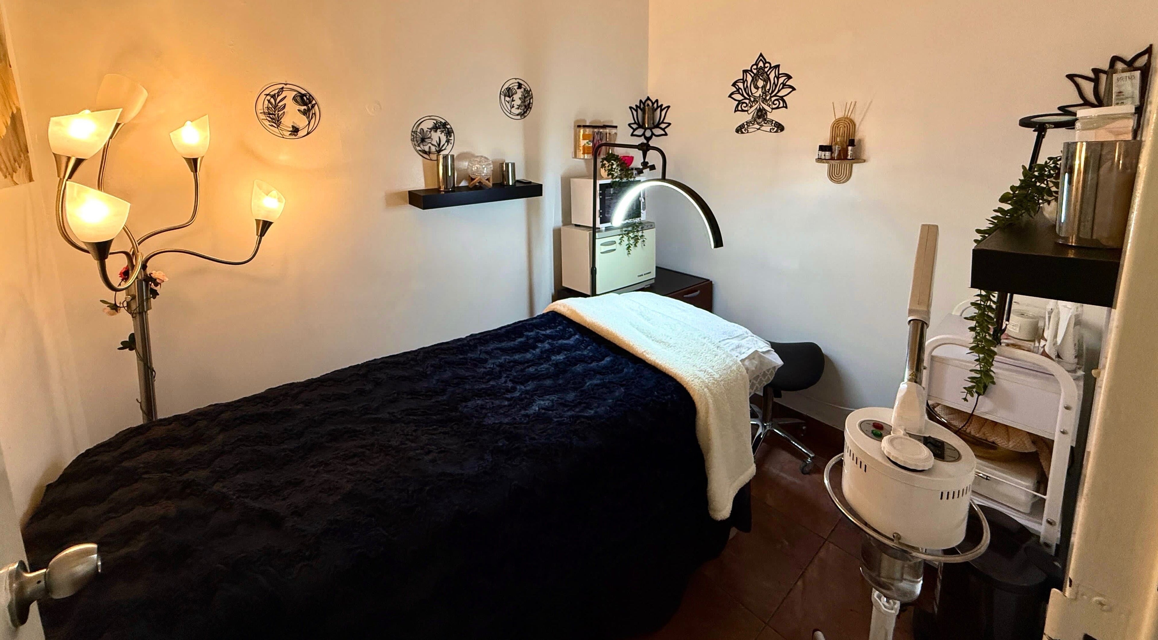 Cozy beauty room at Elite Hair Creations in Toronto, Ontario, CA, featuring a plush treatment bed and warm lighting.