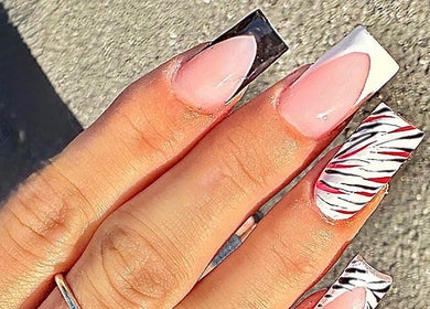 Stylish zebra print nails at Nailsbychloebathgate, Doncaster, England, GB. Perfect for a trendy, bold look.