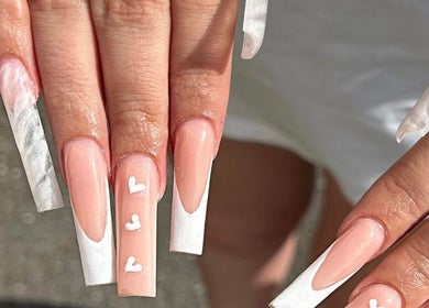 Chic nail design with white tips and heart details at Nailsbychloebathgate, Doncaster, England, GB.