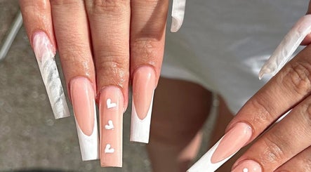 Chic nail design with white tips and heart details at Nailsbychloebathgate, Doncaster, England, GB.
