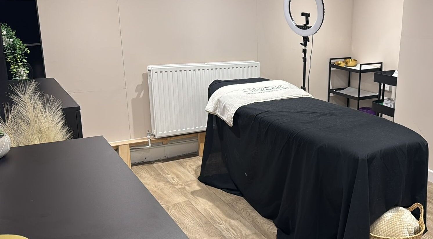 Calming treatment room at Aesthetica, Elland, England, GB, with a massage table and ambient lighting.