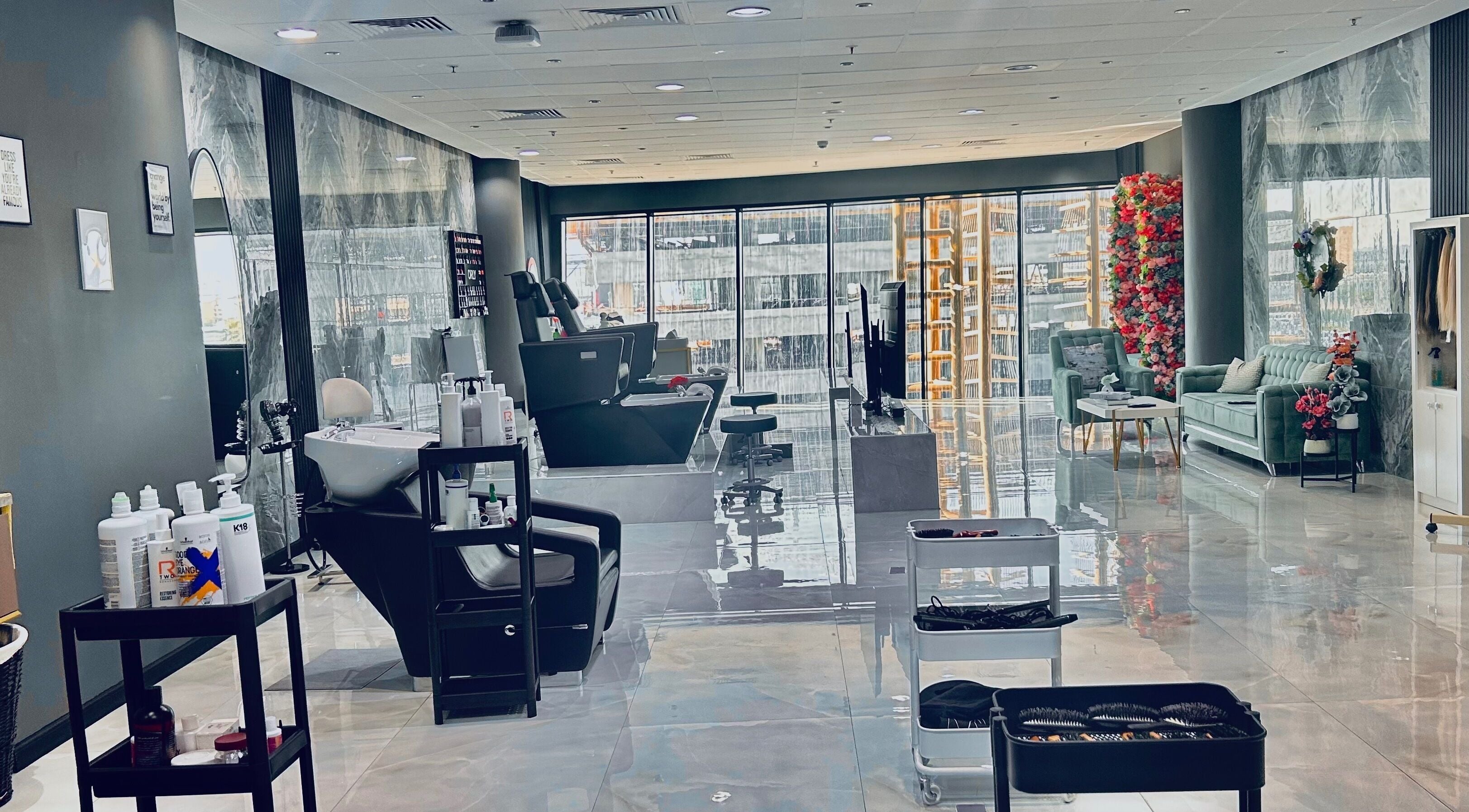 Chic interior of Enigmabeautysalon in Lusail, Al Daayen Municipality, QA, highlighting plush seating and sleek salon chairs.