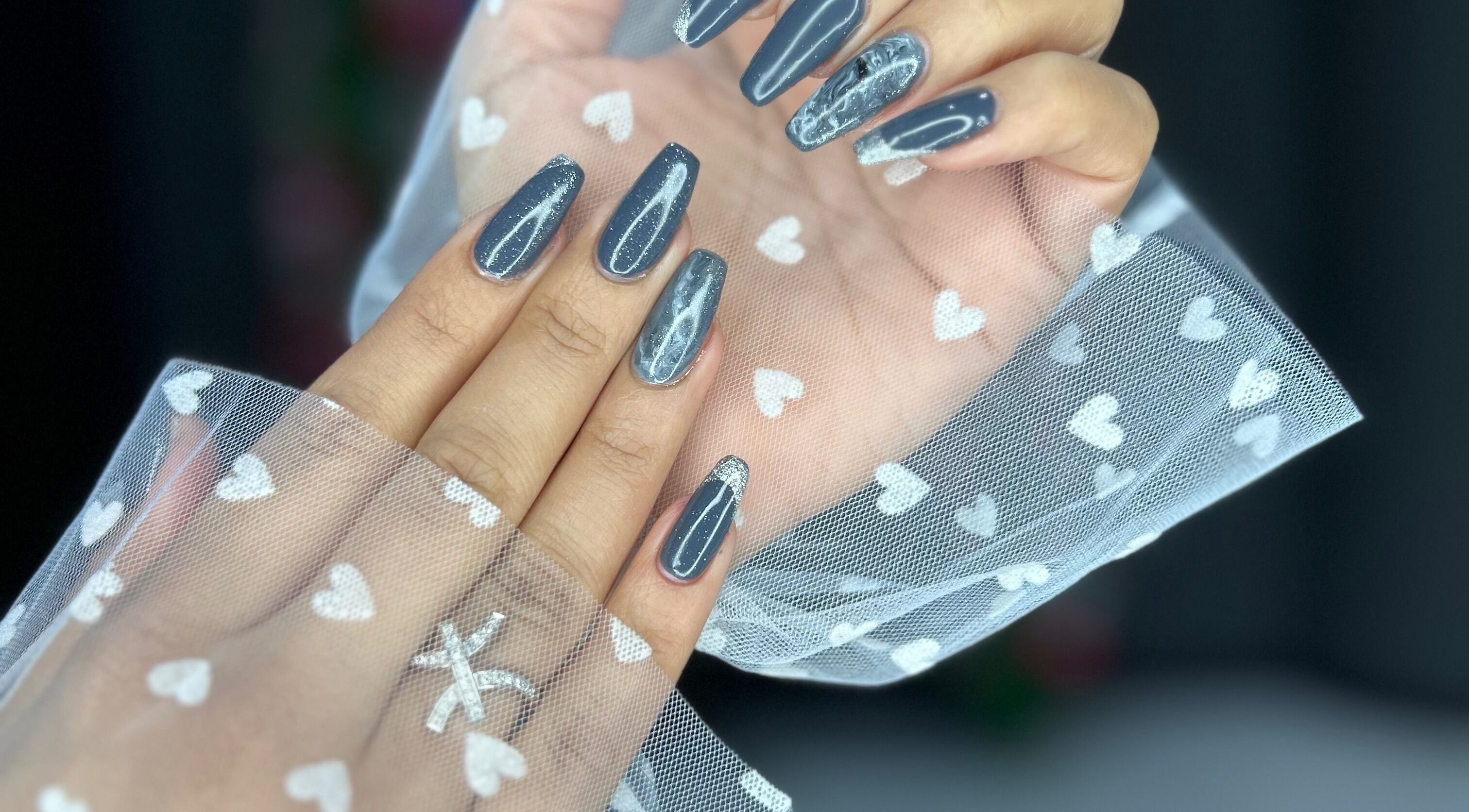 Elegant nail art with gray and silver design at Enigmabeautysalon, Lusail, Al Daayen Municipality, QA.