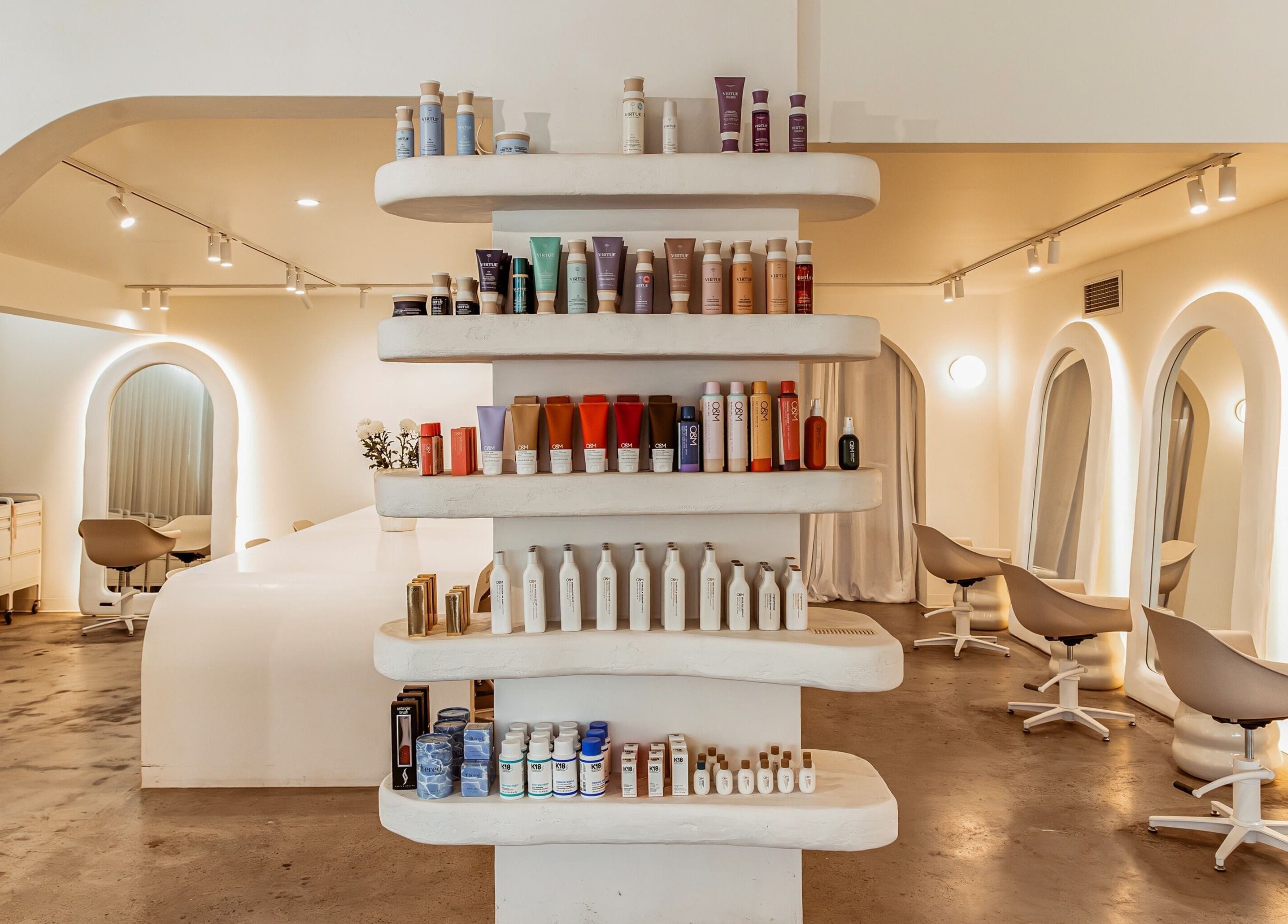 Milly the Space salon in Palm Beach, Queensland, AU with modern seating and stylish product display.