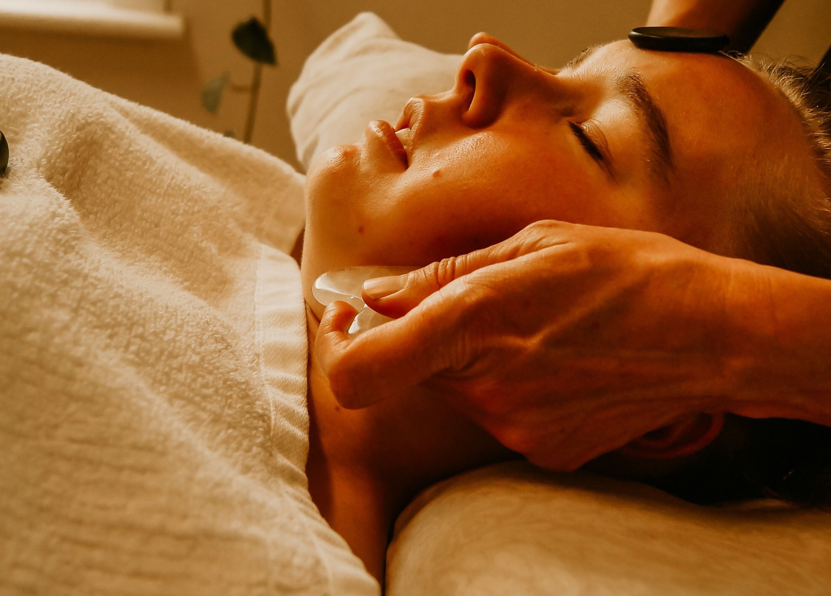 Gua Sha facial treatment at The Temple Of Bliss, Colac, Victoria, AU, promoting relaxation and rejuvenation.