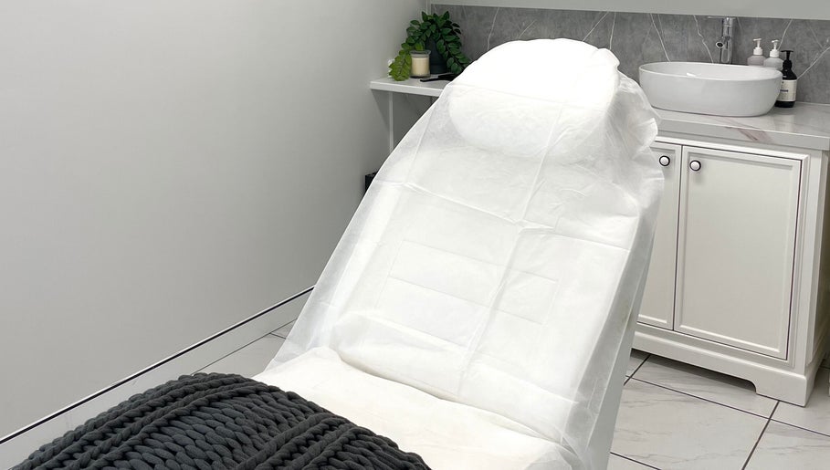 Relaxing treatment room at Cosmetic Nurse Carly, Helensvale, Queensland, AU with a cozy bed and modern decor.