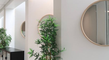 Elegant decor with mirrors and plants at Cosmetic Nurse Carly in Helensvale, Queensland, AU.
