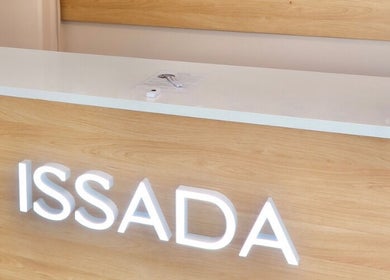 Reception desk at Cosmetic Nurse Carly, Helensvale, Queensland, AU with bright ISSADA signage.