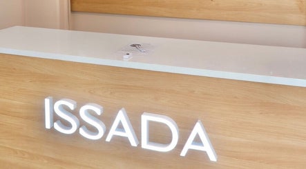 Reception desk at Cosmetic Nurse Carly, Helensvale, Queensland, AU with bright ISSADA signage.