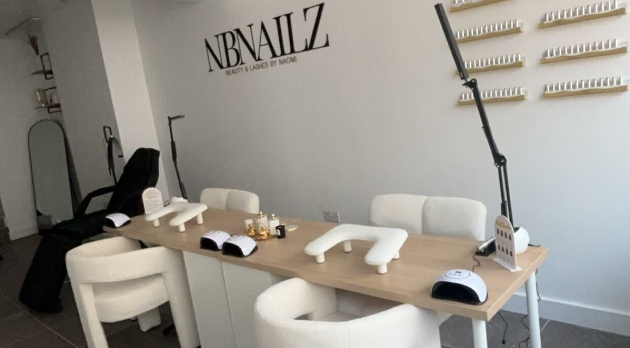 Stylish interior of Nbnailz in Maryport, England, GB featuring modern nail stations and comfortable seating.