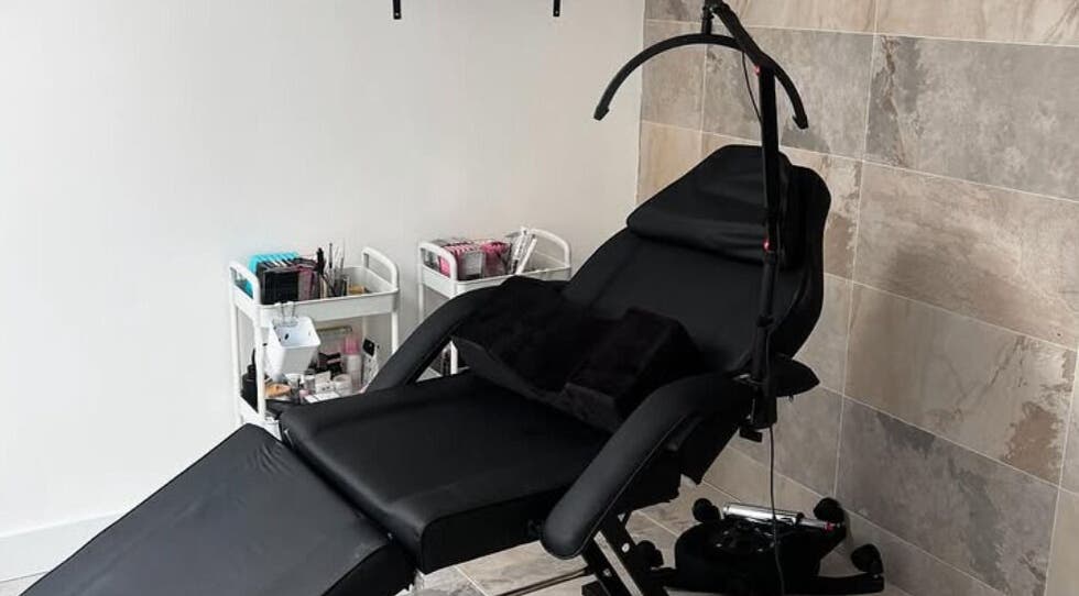 Comfortable beauty treatment chair at Nbnailz, Maryport, England, GB, with tools and supplies in view.