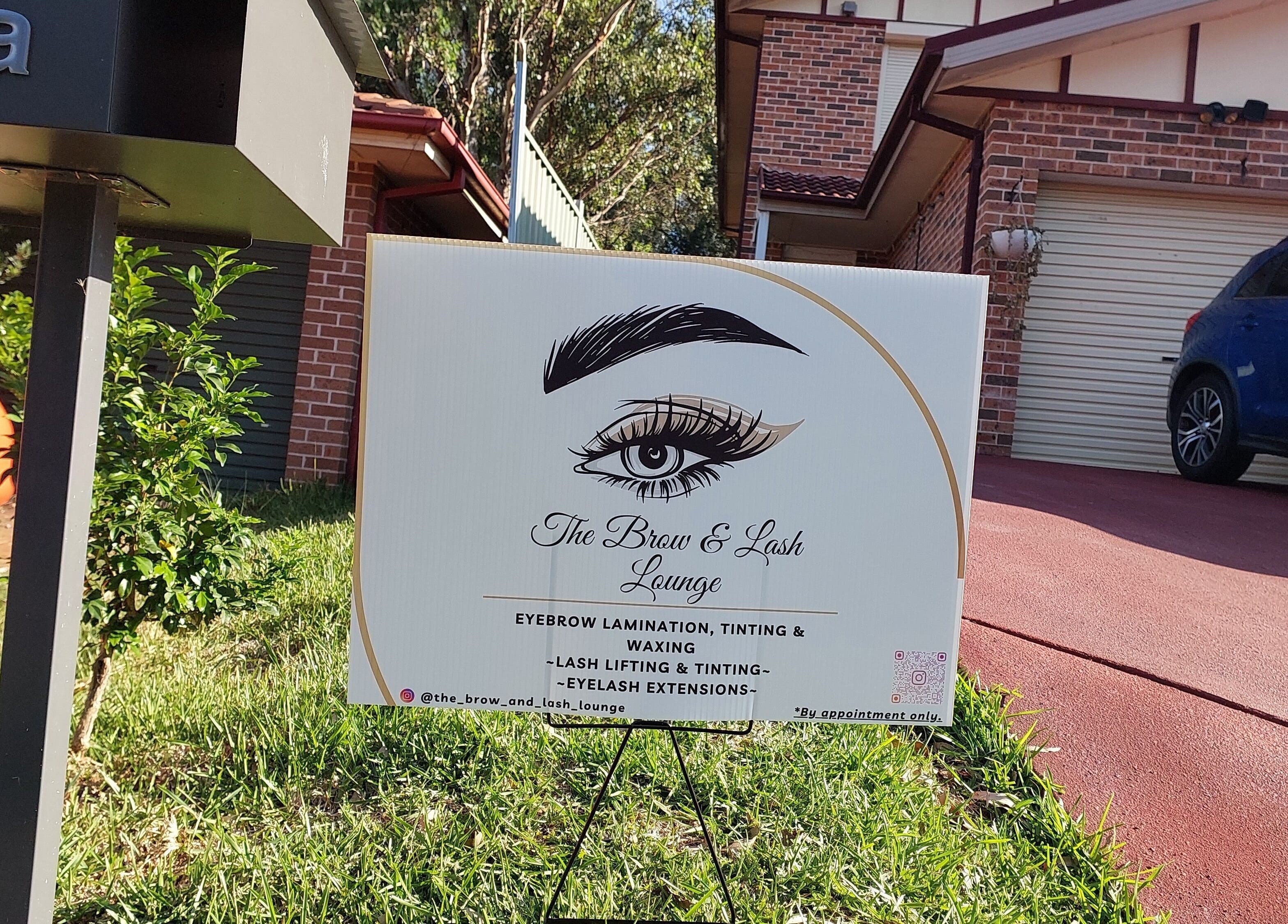 Signage of The Brow and Lash Lounge by Patricia in Doonside, New South Wales, AU, with lush greenery.