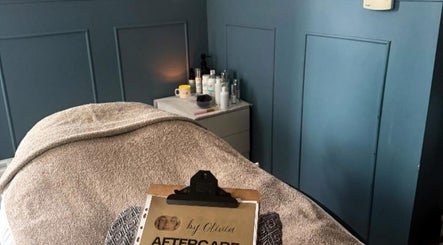 Relaxing treatment room at Beauty by Liv, Bourne, England, GB, featuring a cozy bed and skincare products.
