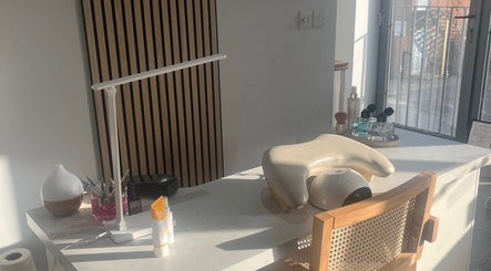 Beauty station at By Sophie, Knowle, England, GB with massage chair and wellness products.