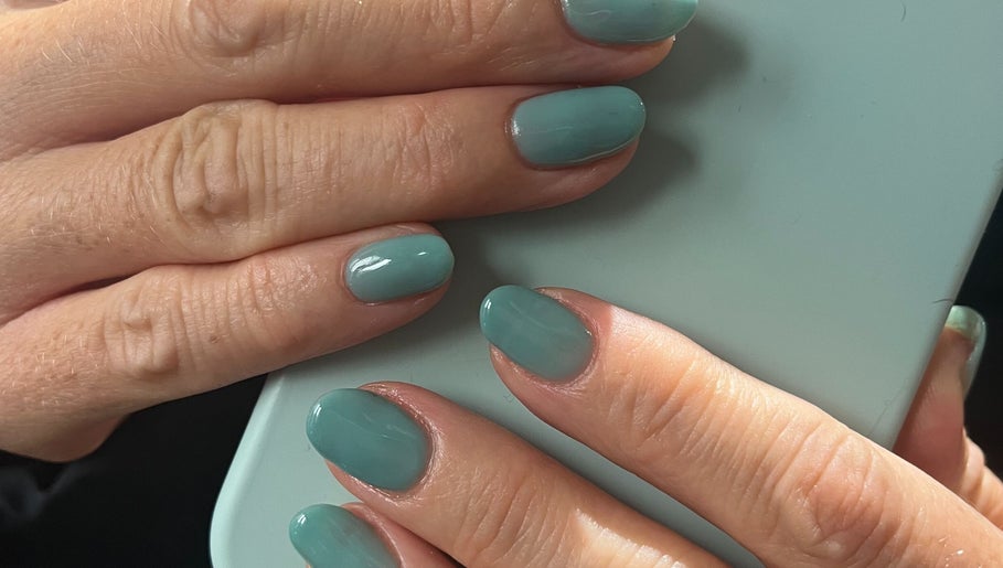 Elegant mint green manicure at By Sophie in Knowle, England, GB highlighting trendy nail art.