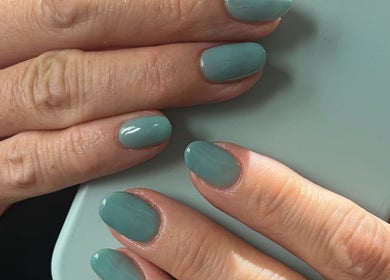 Elegant mint green manicure at By Sophie in Knowle, England, GB highlighting trendy nail art.