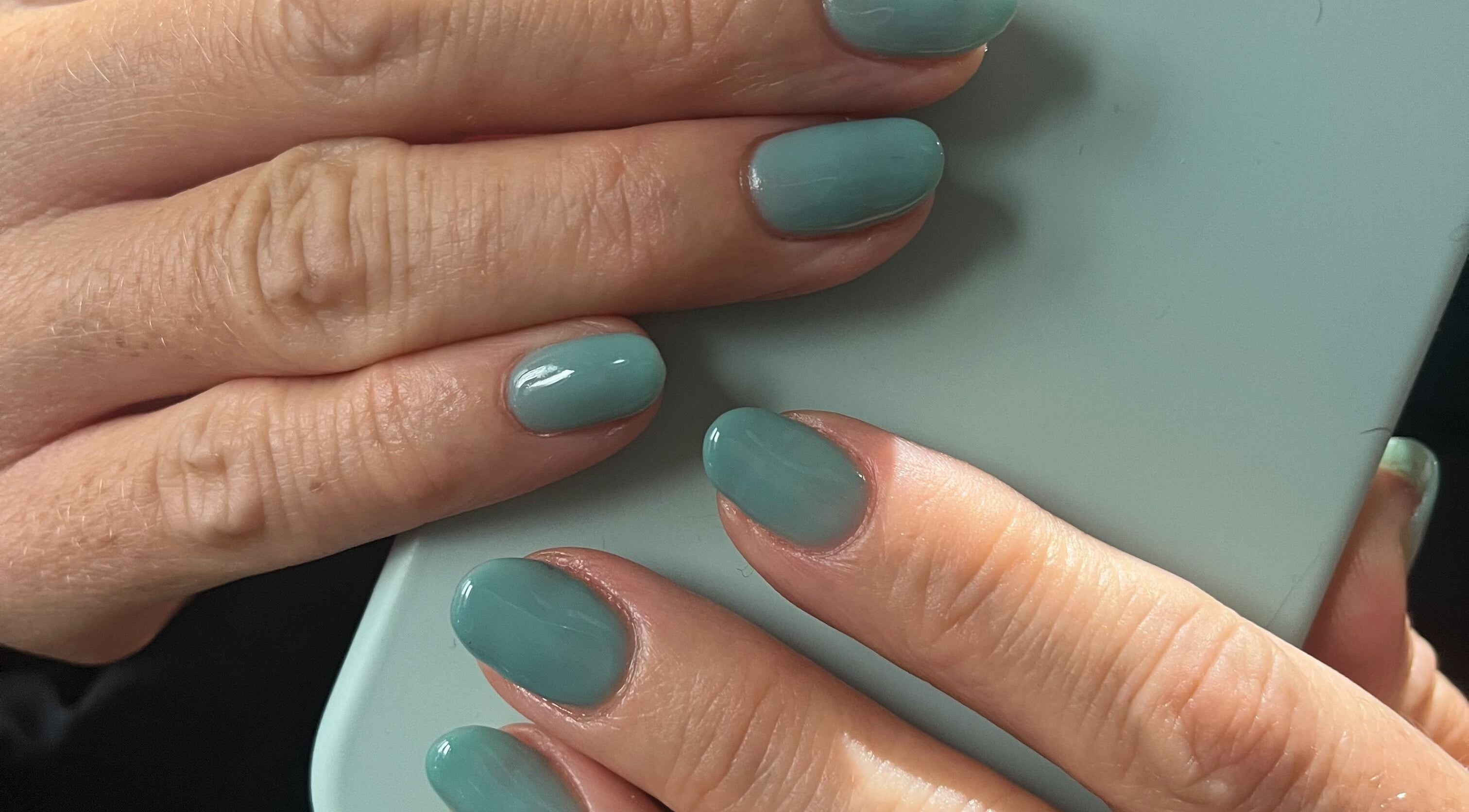 Elegant mint green manicure at By Sophie in Knowle, England, GB highlighting trendy nail art.