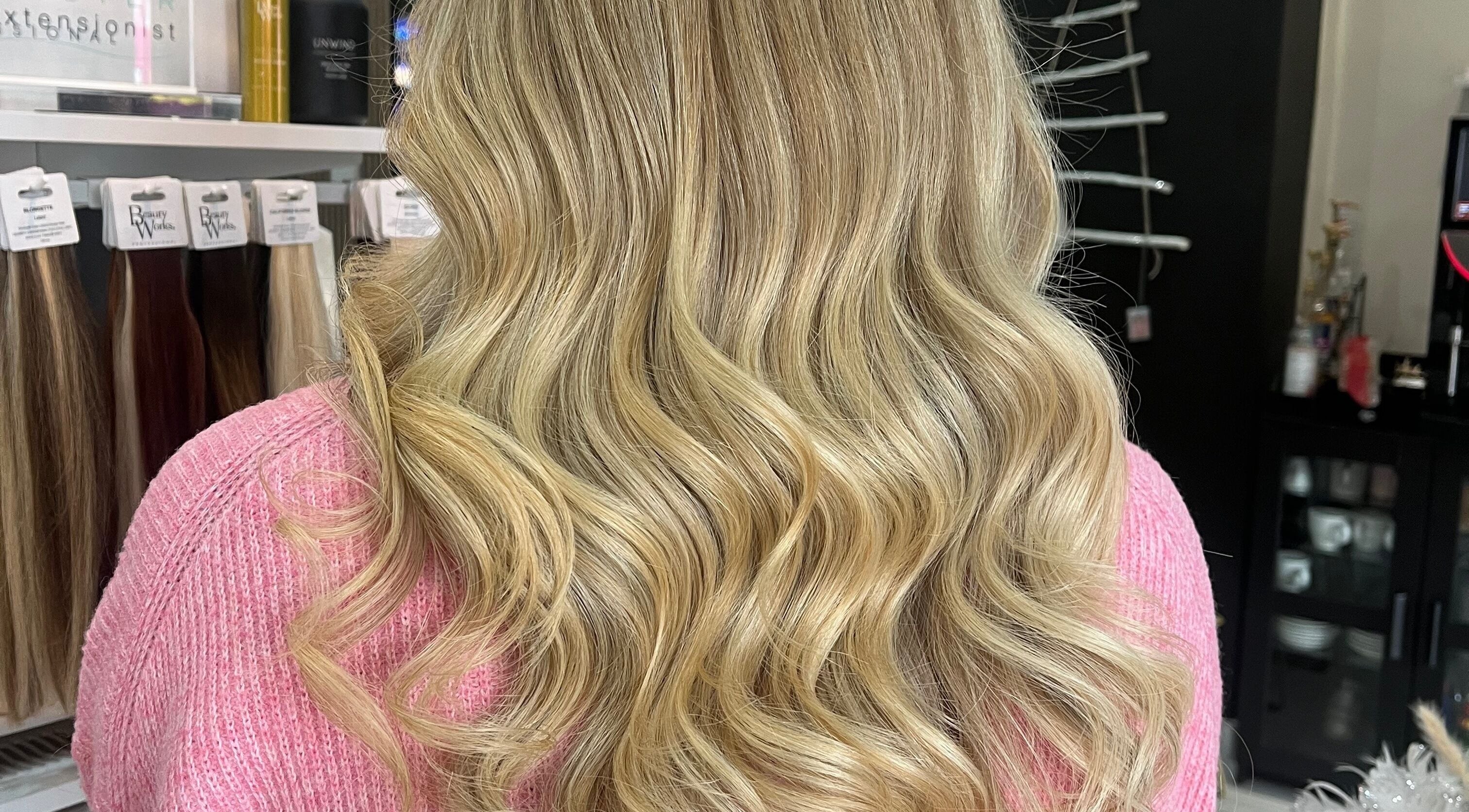 Blonde wavy hairstyle at Bethany Jade Hairdressing, Cannock, England, GB, showcasing elegant curls.