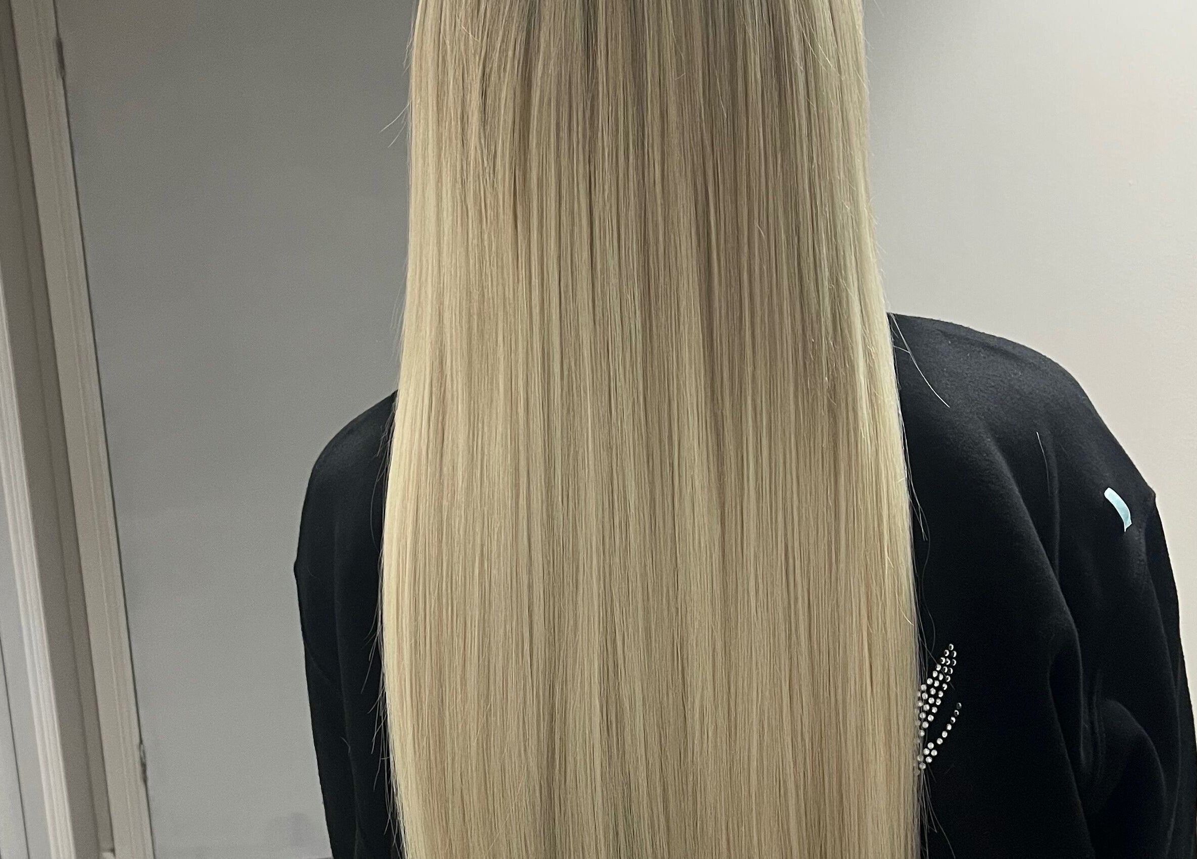 Long, straight, blonde hair styled at Bethany Jade Hairdressing, Cannock, England, GB.