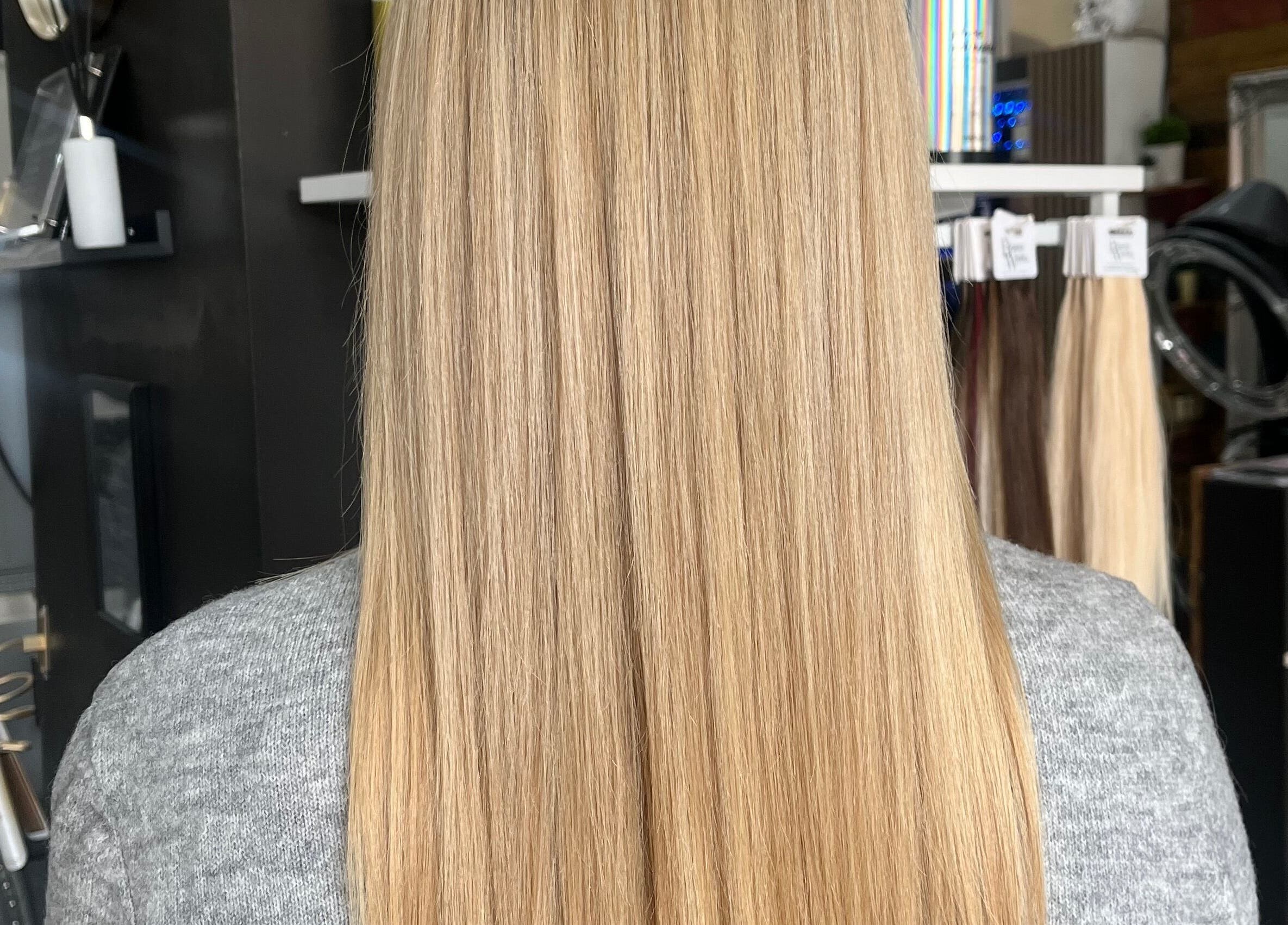 Long, straight blonde hair styled at Bethany Jade Hairdressing, Cannock, England, GB.