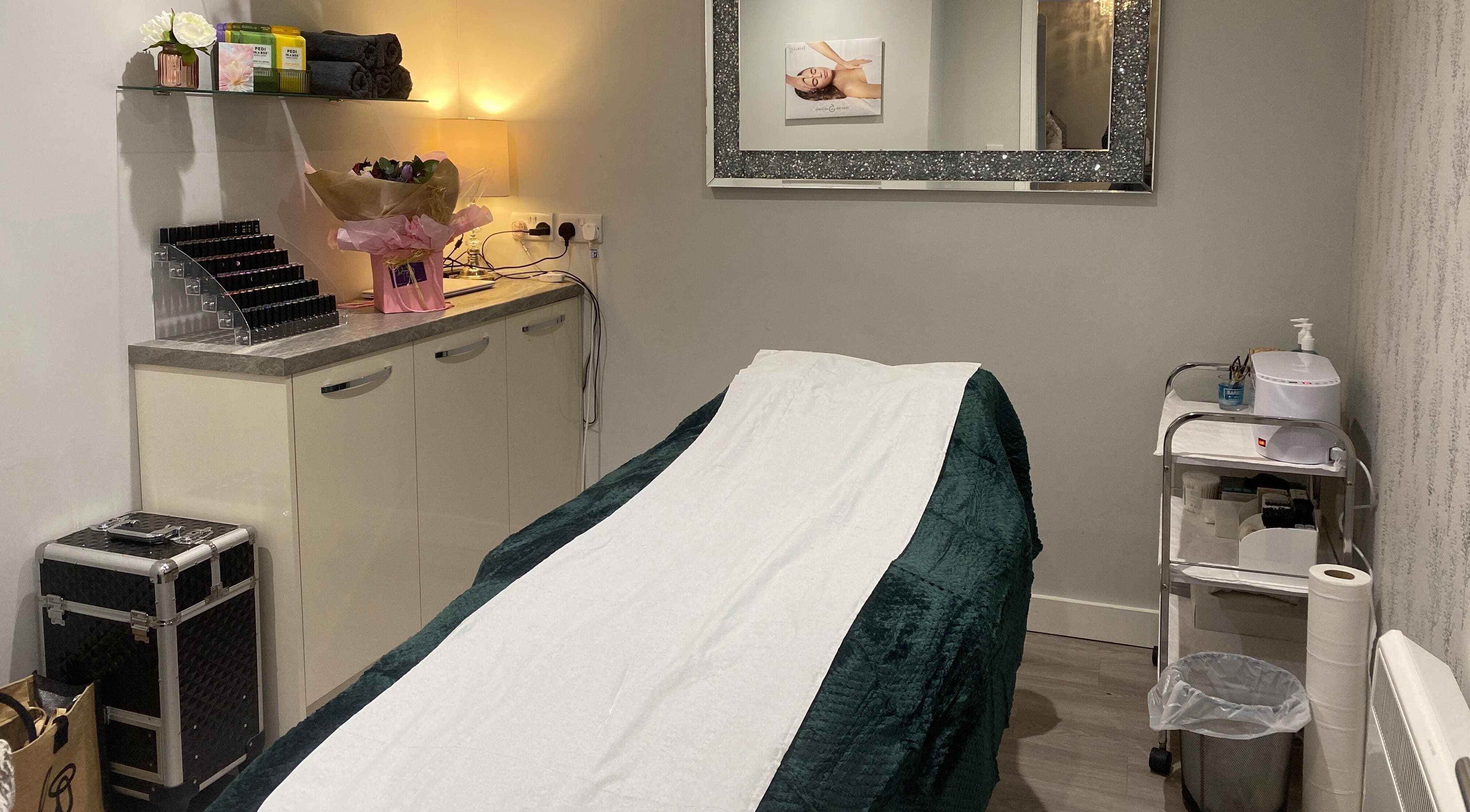 Relaxing spa treatment room at Nails and More at No.4, Ross-on-Wye, England, GB, with massage table.