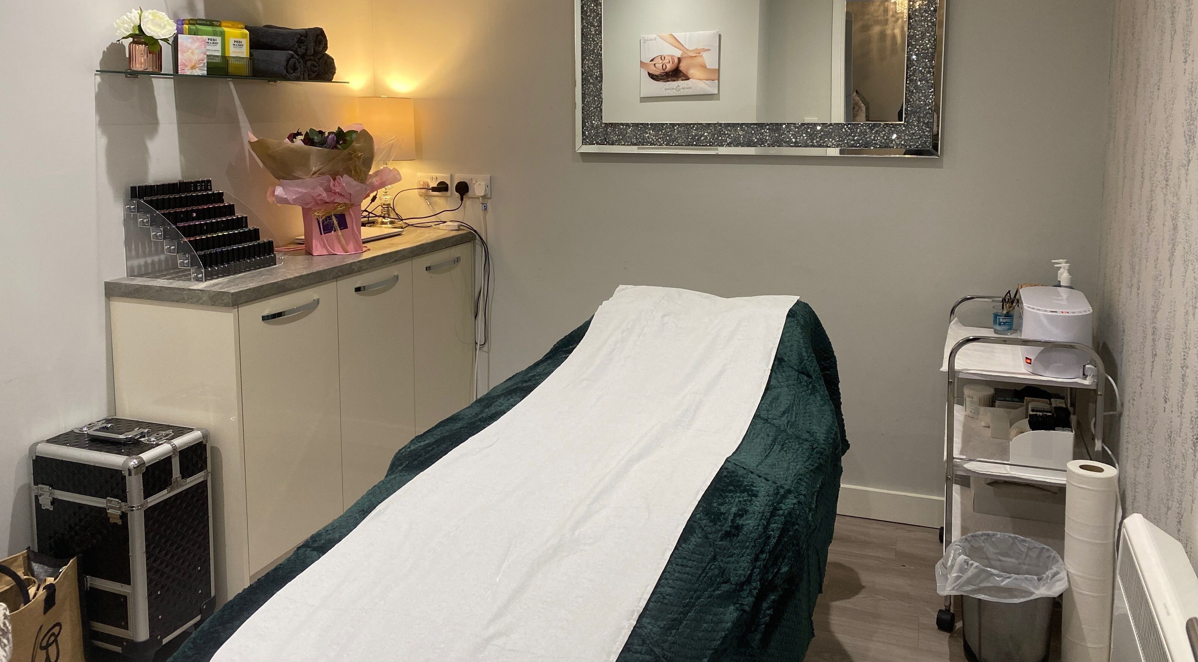 Relaxing spa treatment room at Nails and More at No.4, Ross-on-Wye, England, GB, with massage table.