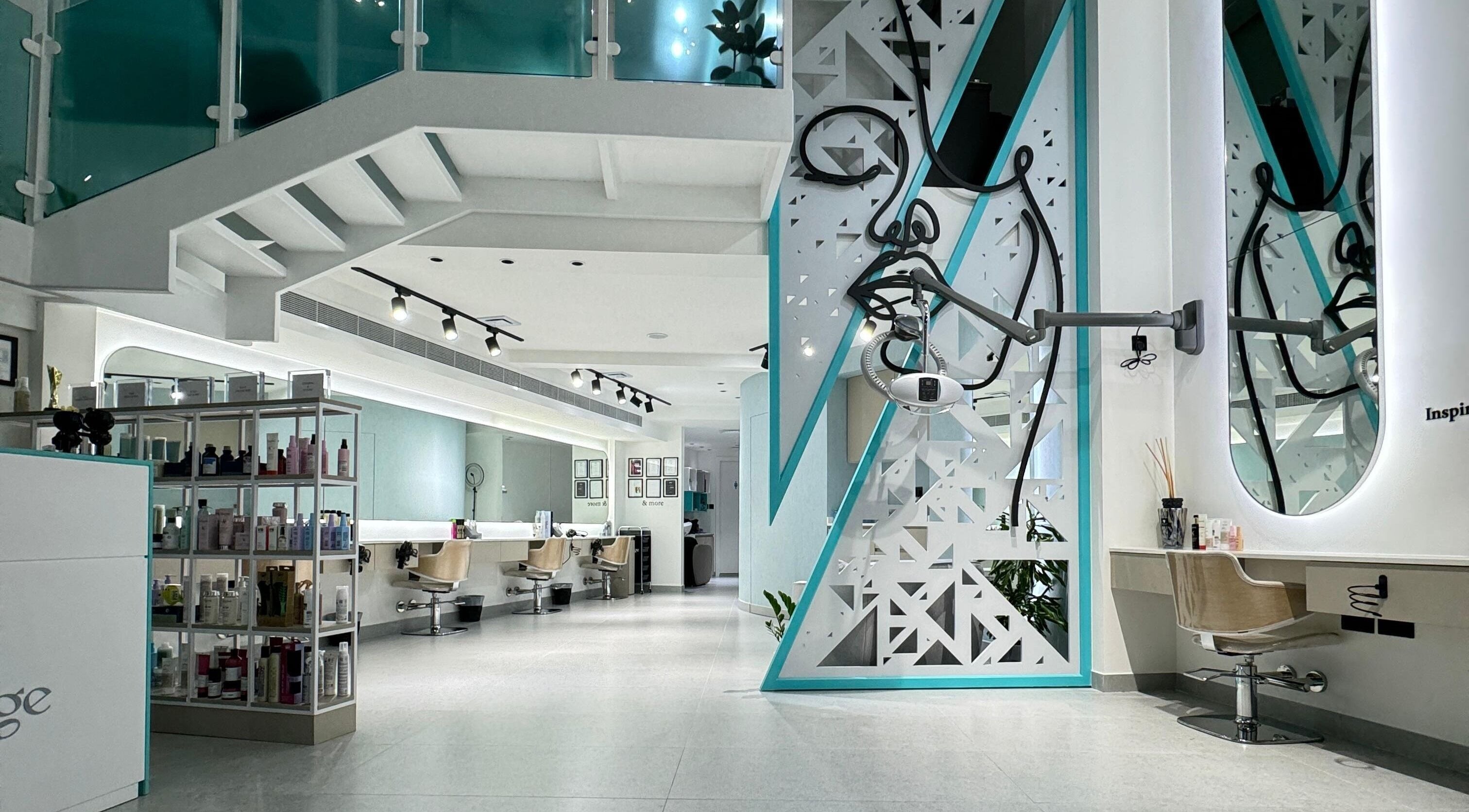 Modern interior of Hairitage Beauty Corner W.L.L in Manama, Capital Governorate, BH, showcasing styling stations.