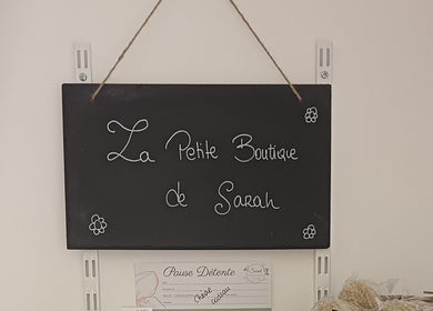 Enseigne de La Petite Boutique de Sarah à Sarah Naturopathe & Massages Bien-être, Grémonville, Normandie, FR.