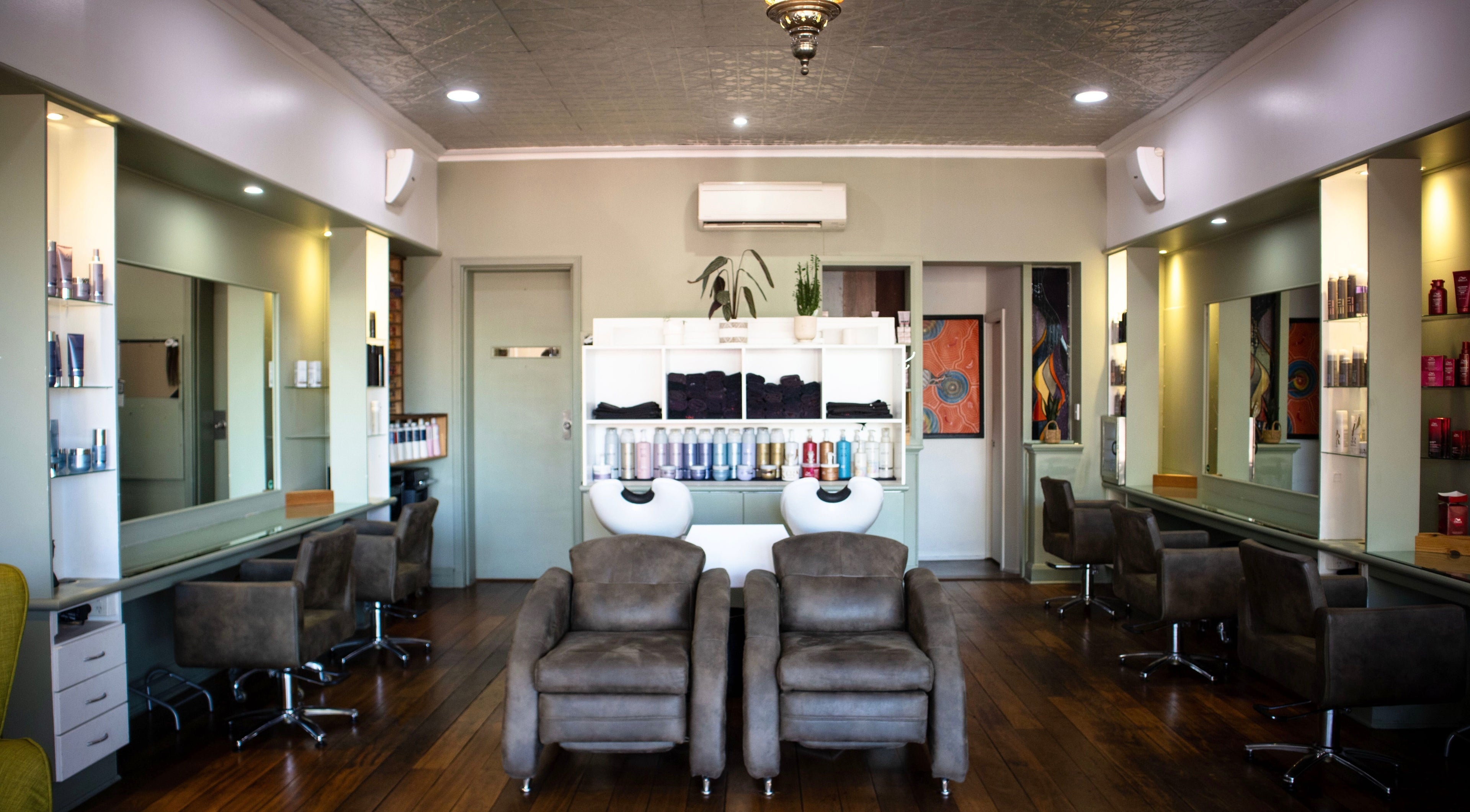 Stylish interior of This Above All Hair in Kensington, Western Australia, AU featuring modern salon chairs.
