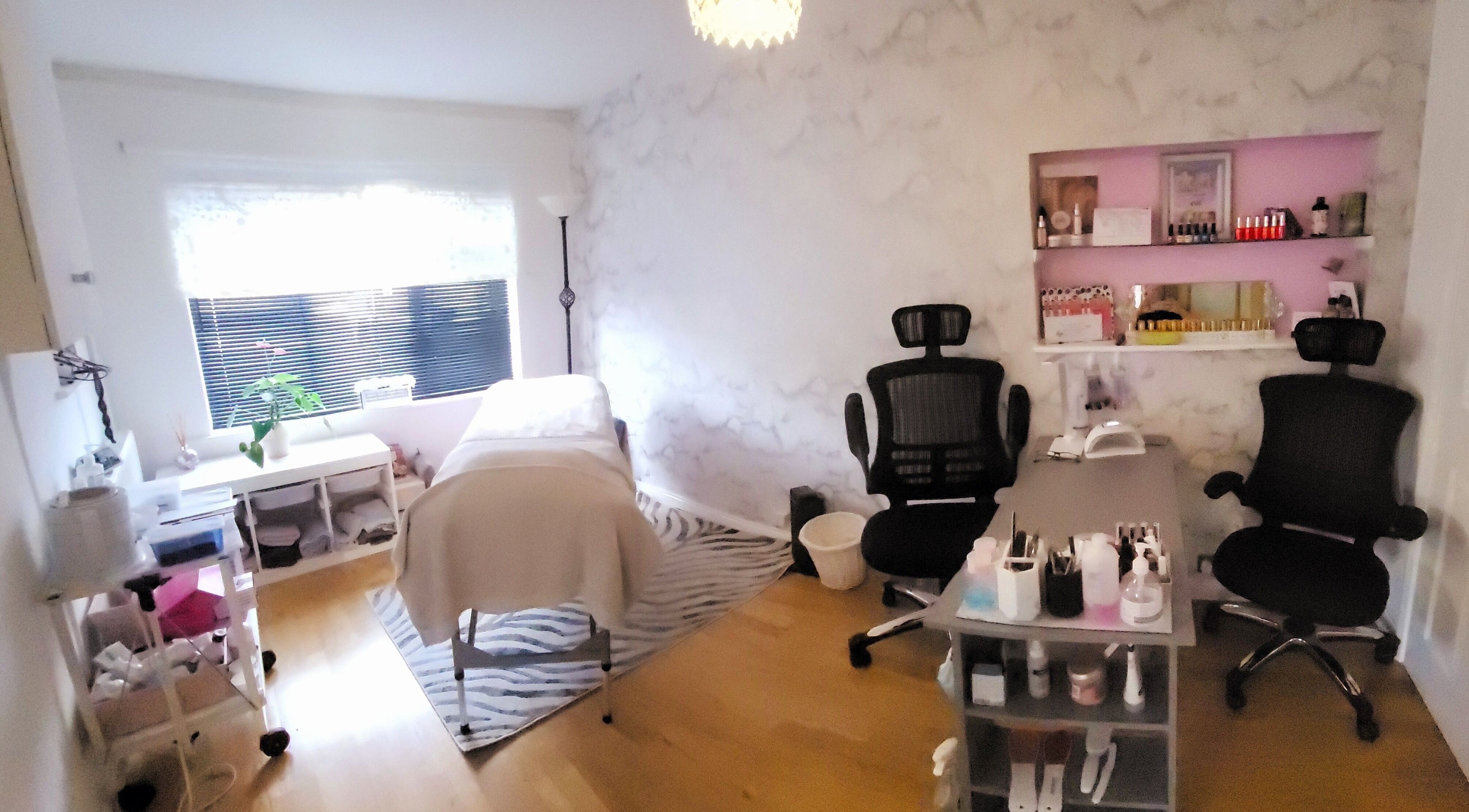 Beautiques therapy room in Fleet, England, GB featuring treatment bed and elegant decor.