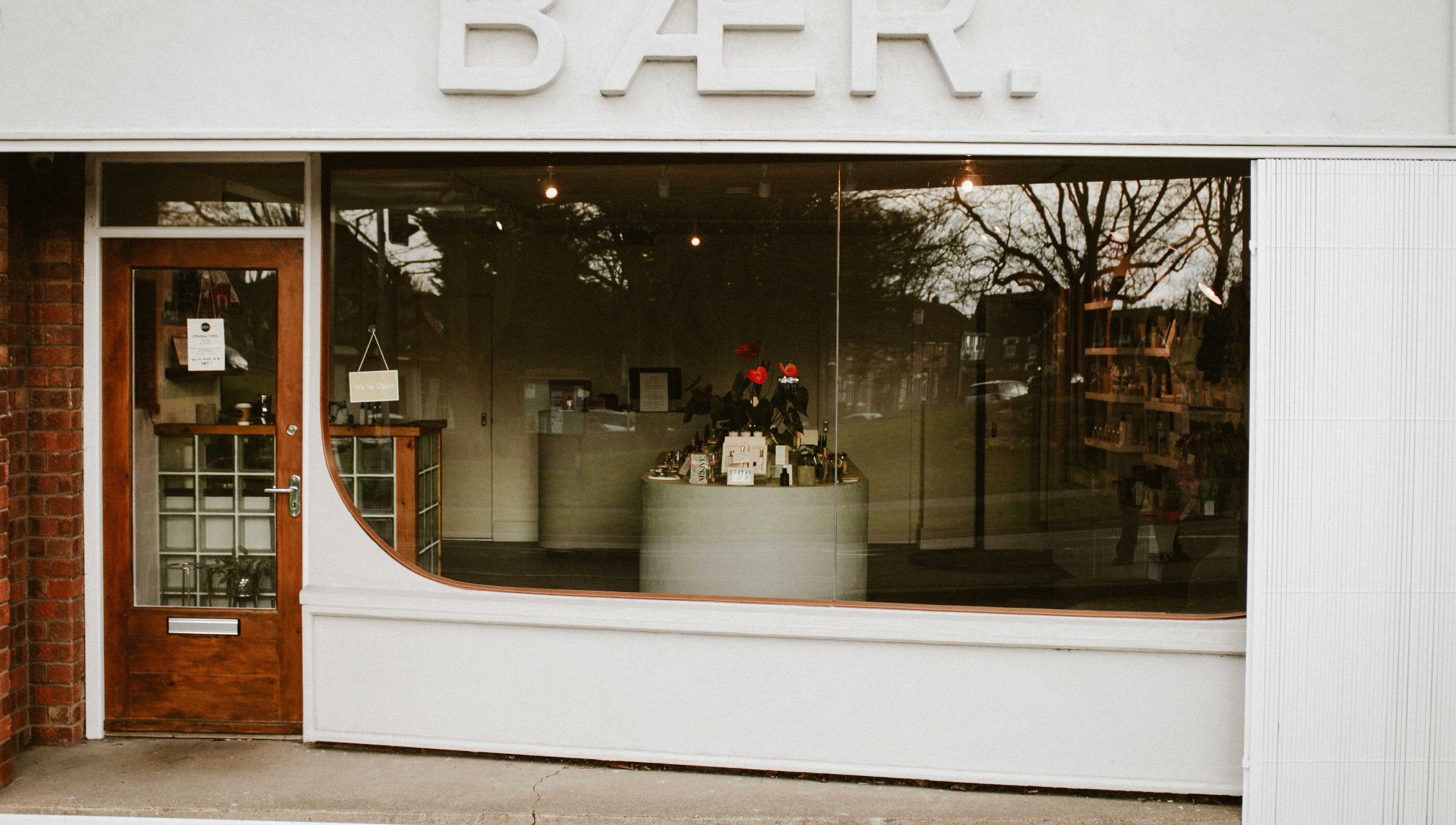 Front view of BAER. beauty and wellness venue in Waltham, England, GB with stylish window display.