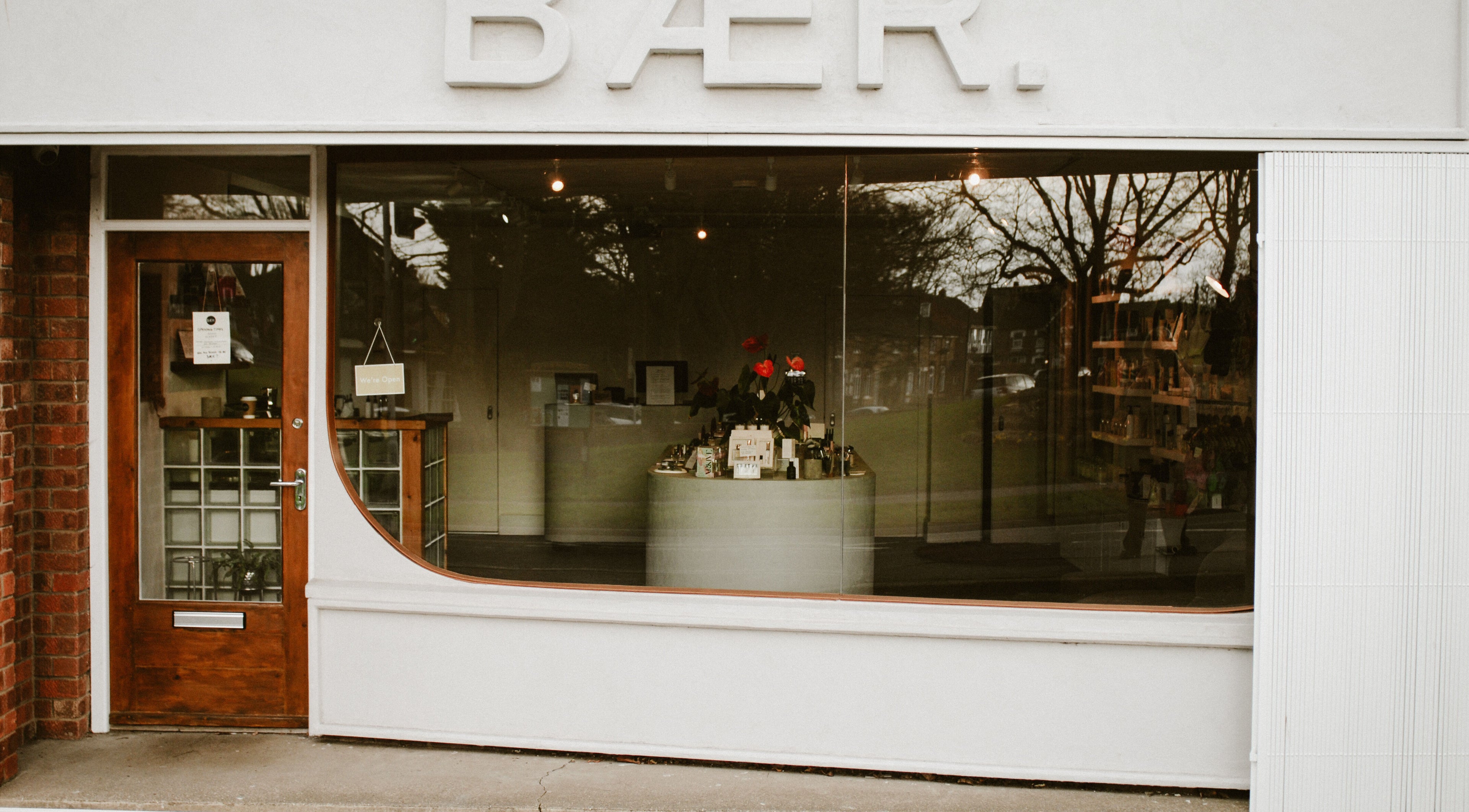 Front view of BAER. beauty and wellness venue in Waltham, England, GB with stylish window display.