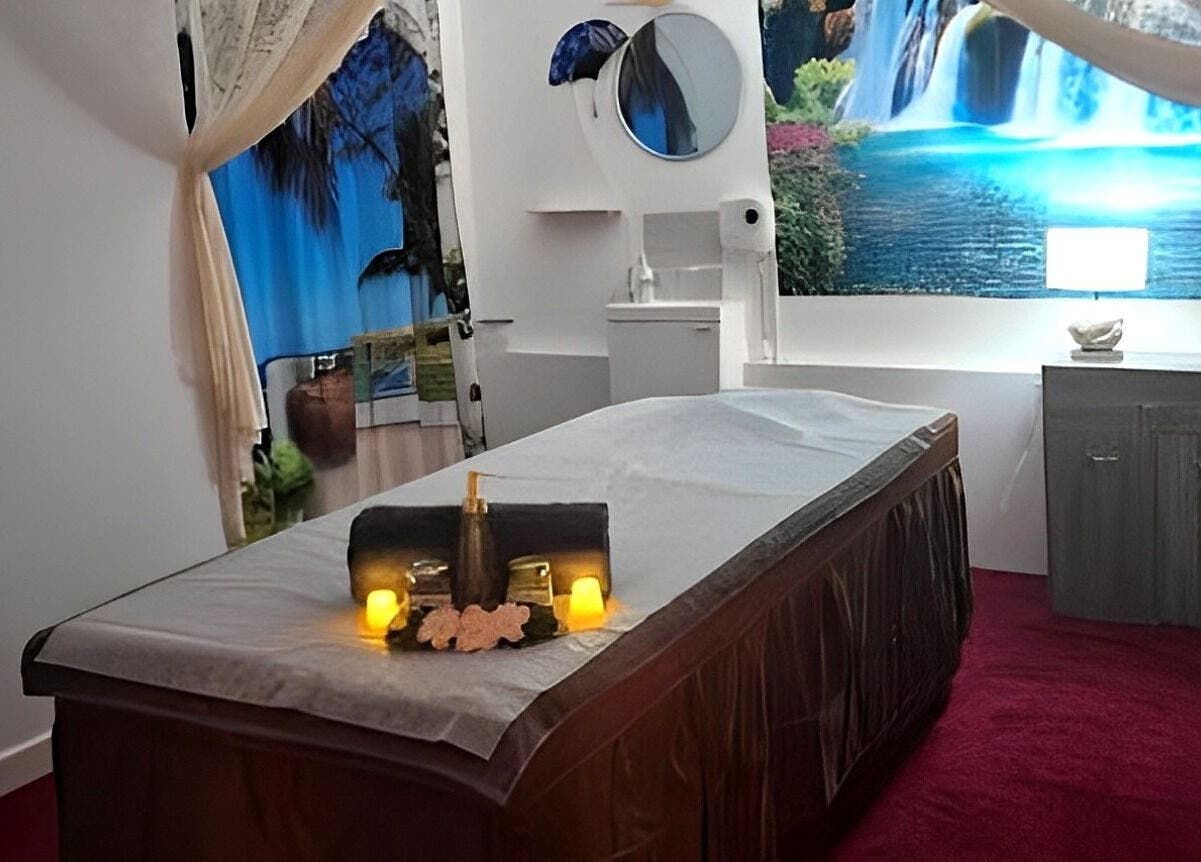 Tranquil massage room at Shewa Thai Massage & Spa, Stoke-on-Trent, England, GB, featuring a soothing waterfall mural.
