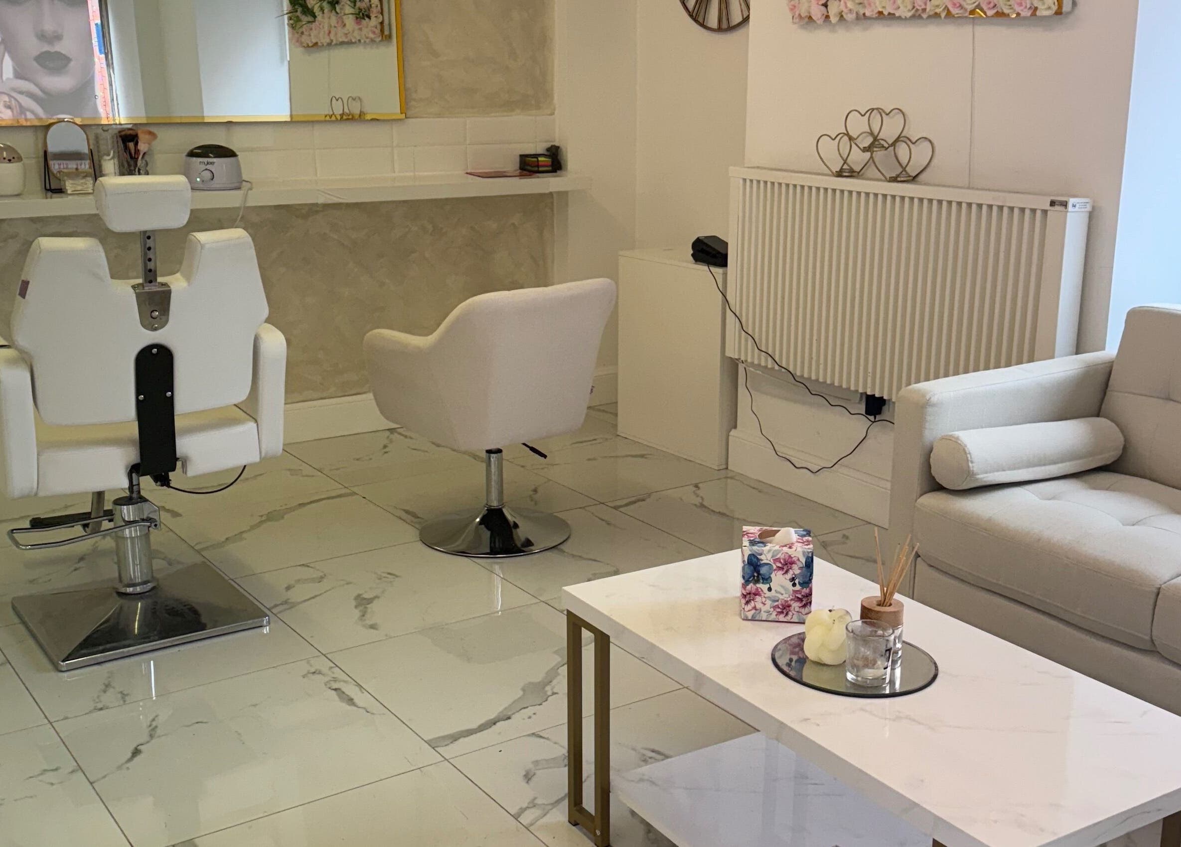 Chic salon interior at Mona, Glasgow, Scotland, GB featuring modern seating and stylish decor.