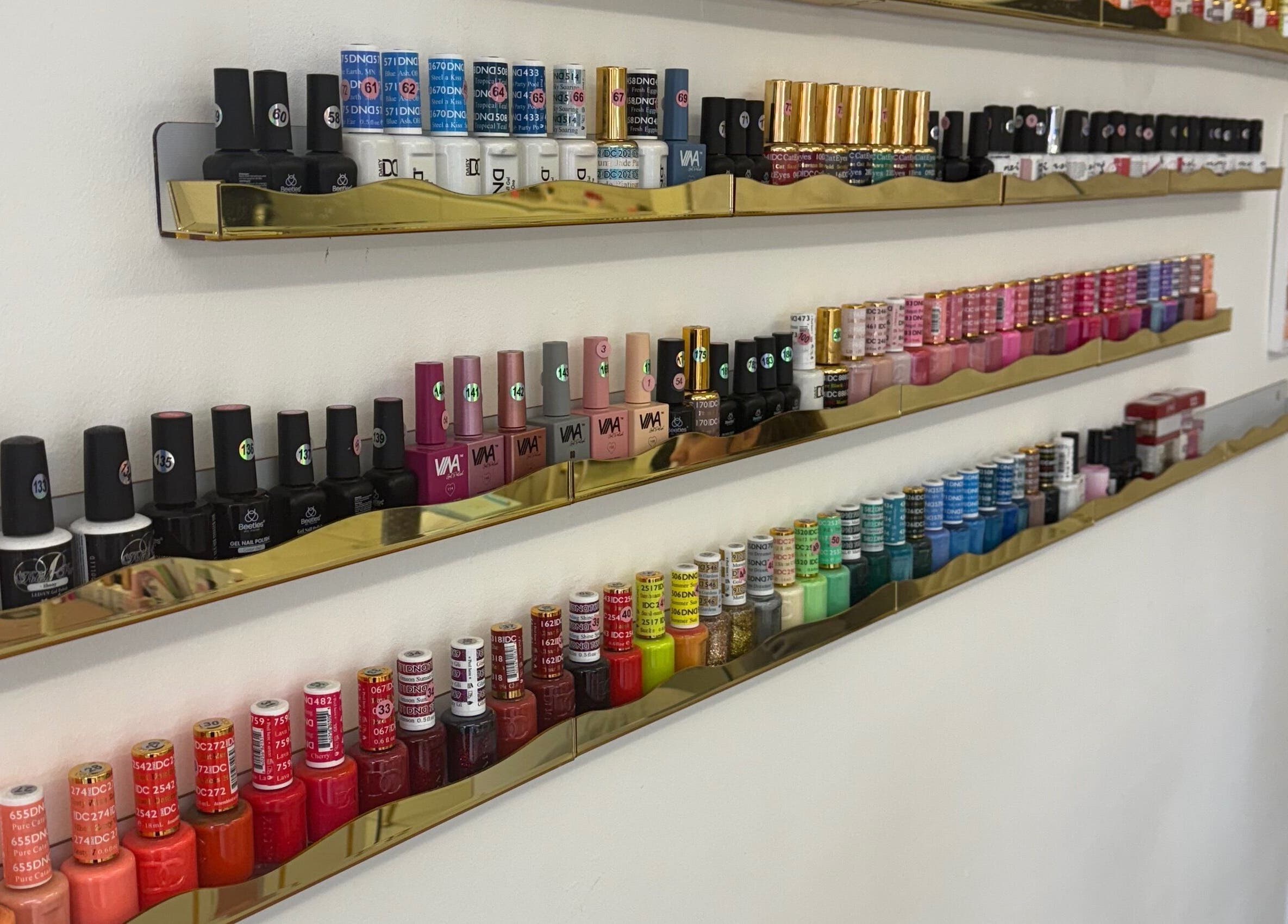 Vibrant nail polish collection at Mona, Glasgow, Scotland, GB. Perfect for unique salon experiences.