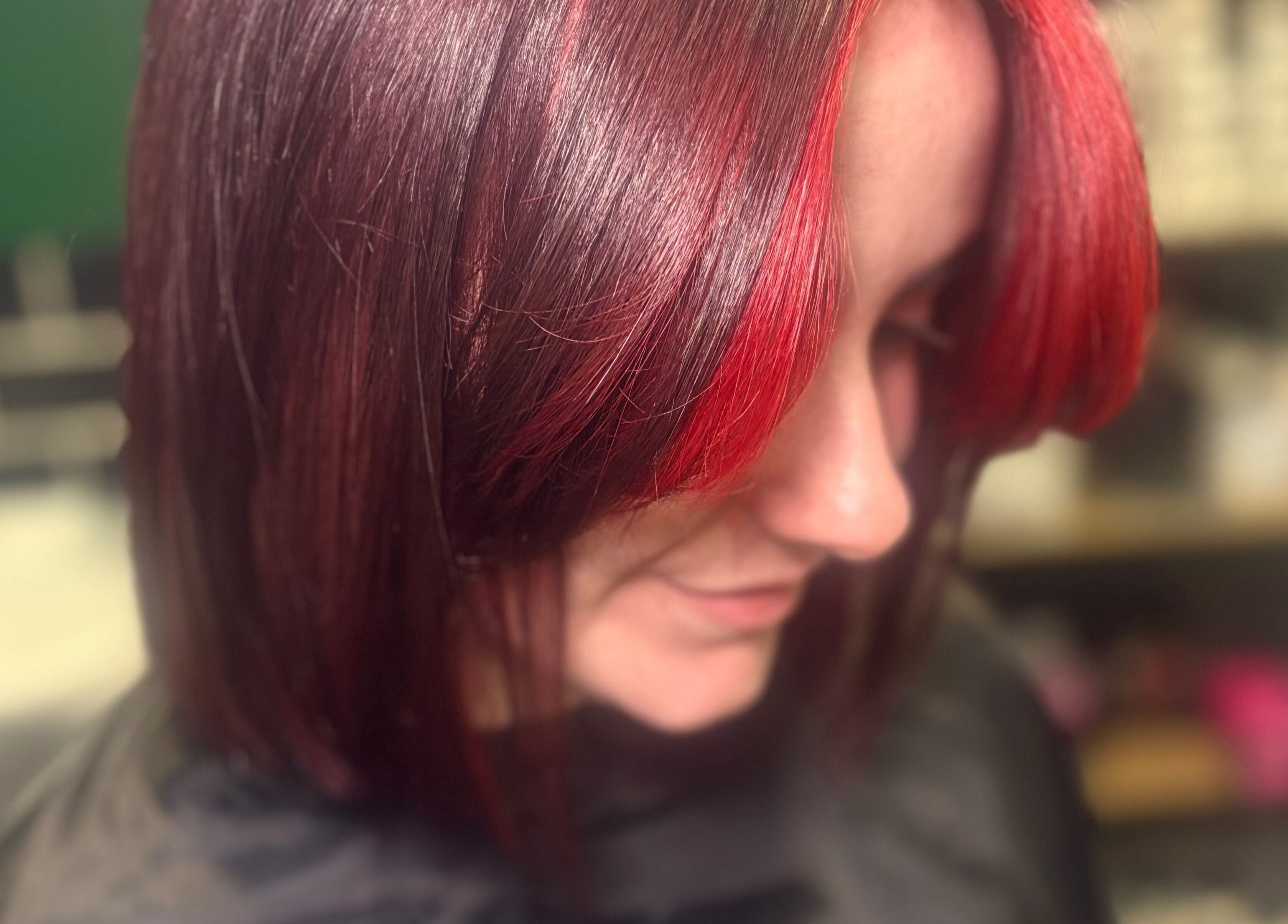 Stylish red-toned hairstyle at Hideaway Hair and Beauty, Llandeilo, Wales, GB.