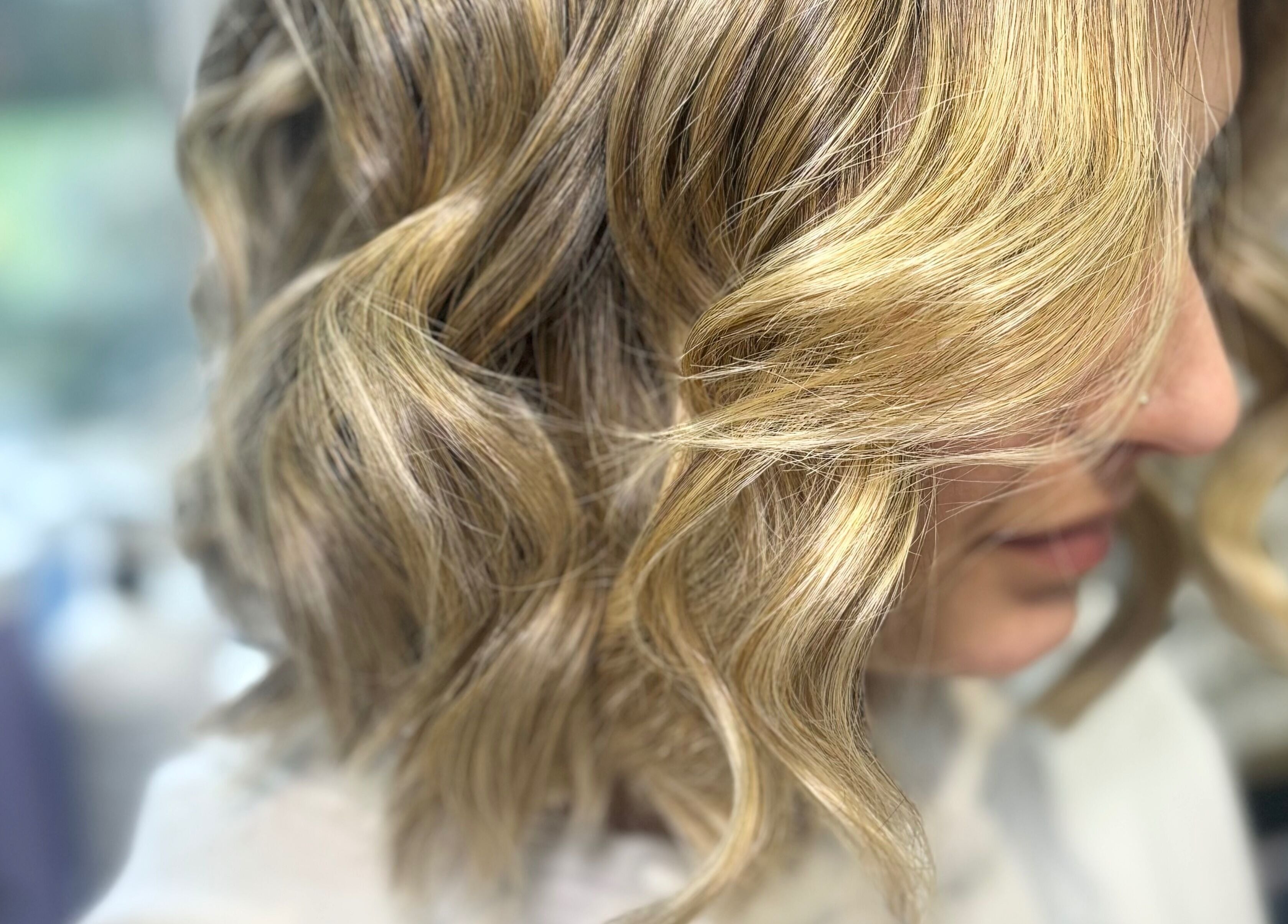 Blonde wavy hairstyle at Hideaway Hair and Beauty, Llandeilo, Wales, GB.