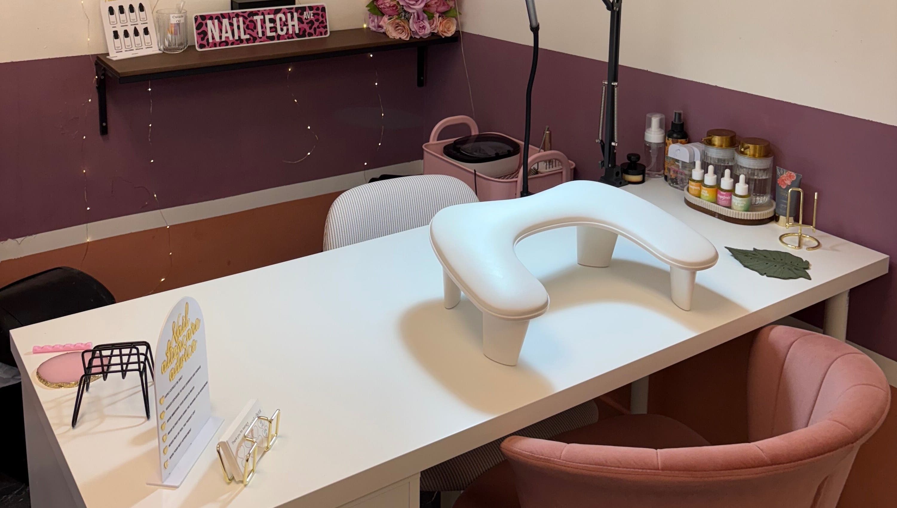 Chic nail station at Gels by Eleanor, Glasgow, Scotland, GB, featuring pink decor and nail products.