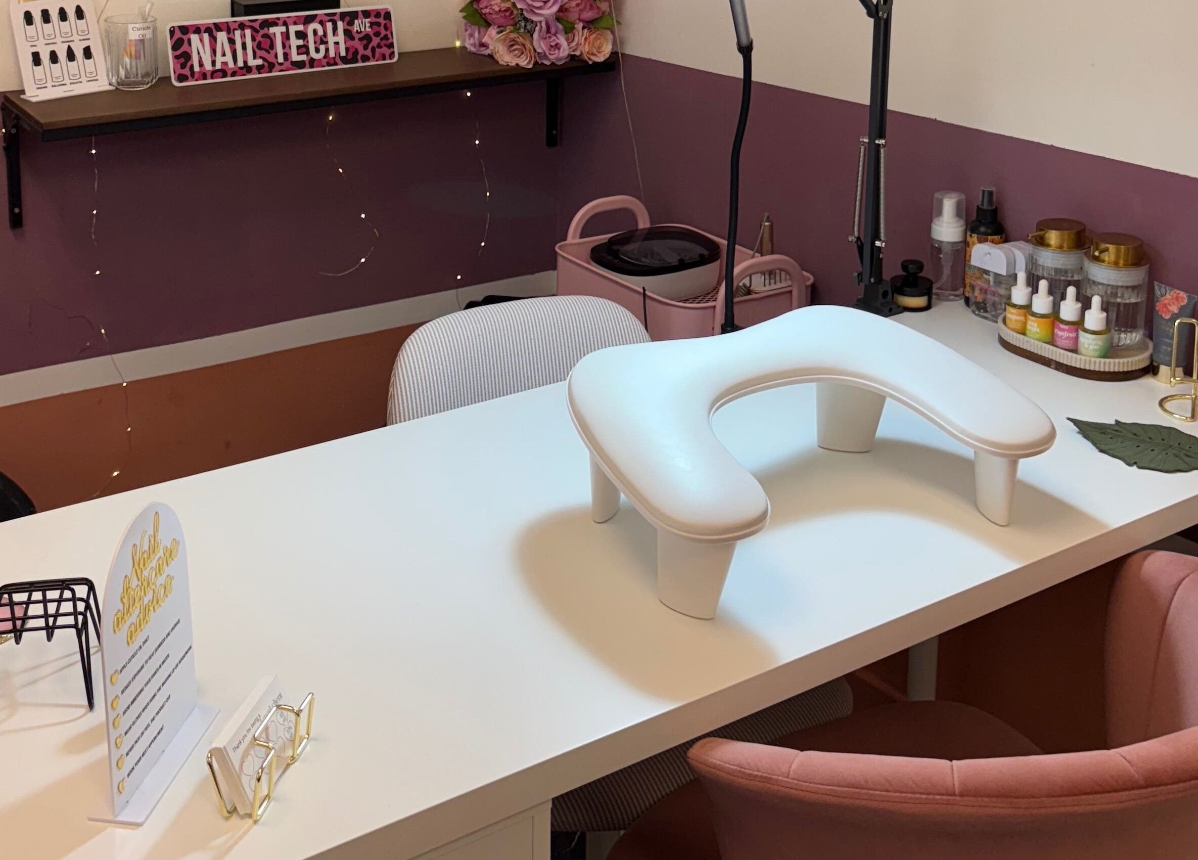 Chic nail station at Gels by Eleanor, Glasgow, Scotland, GB, featuring pink decor and nail products.